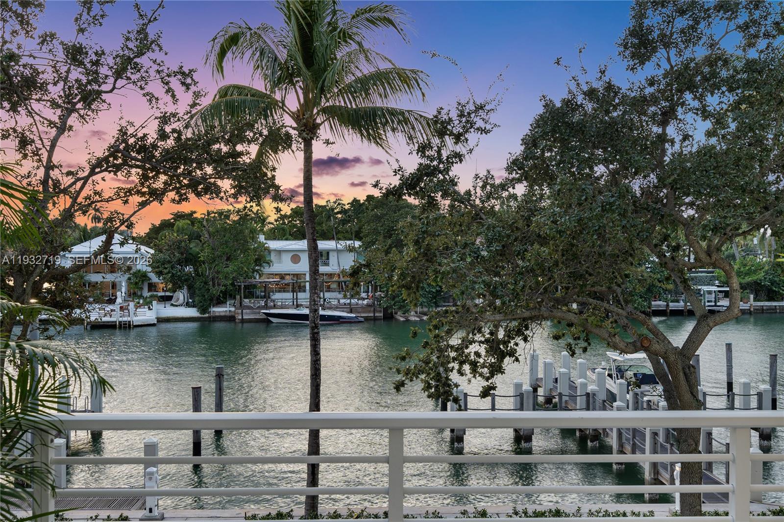 This 4,584 SF home offers five en suite bedrooms and expansive indoor outdoor living with nearly 7,000 SF of usable space, featuring wide water sunset views, a deeded private dock, private elevator, and two car garage, just one block from the beach and a short golf cart ride to La Gorce Country Club.The residence features high ceilings and interiors that capture sunset and skyline views, with RH Luxe décor available, an oversized RH chandelier, media lounge, formal waterfront dining, and five en suite bedrooms, each with private outdoor space.Finishes include limestone floors, Carrara marble, and quartz surfaces. The great room flows into a chef’s kitchen with waterfall island, Thermador and Sub Zero appliances, induction cooking, and natural gas. Multiple terraces create true outdoor living ideal for entertaining, yoga, barbecues, gardening, or a private gym. Enjoy no fixed bridge boating from your private dock, or take your golf cart to the beach or La Gorce Country Club.Aqua at Allison Island offers two resort style pools, a full service spa, 6,000 SF fitness center, concierge services, and a waterfront boardwalk minutes from Bal Harbour Shops, South of Fifth, Downtown Miami, and the Design District. The Green House is one of only a handful of true trophy residences within Aqua that remain.