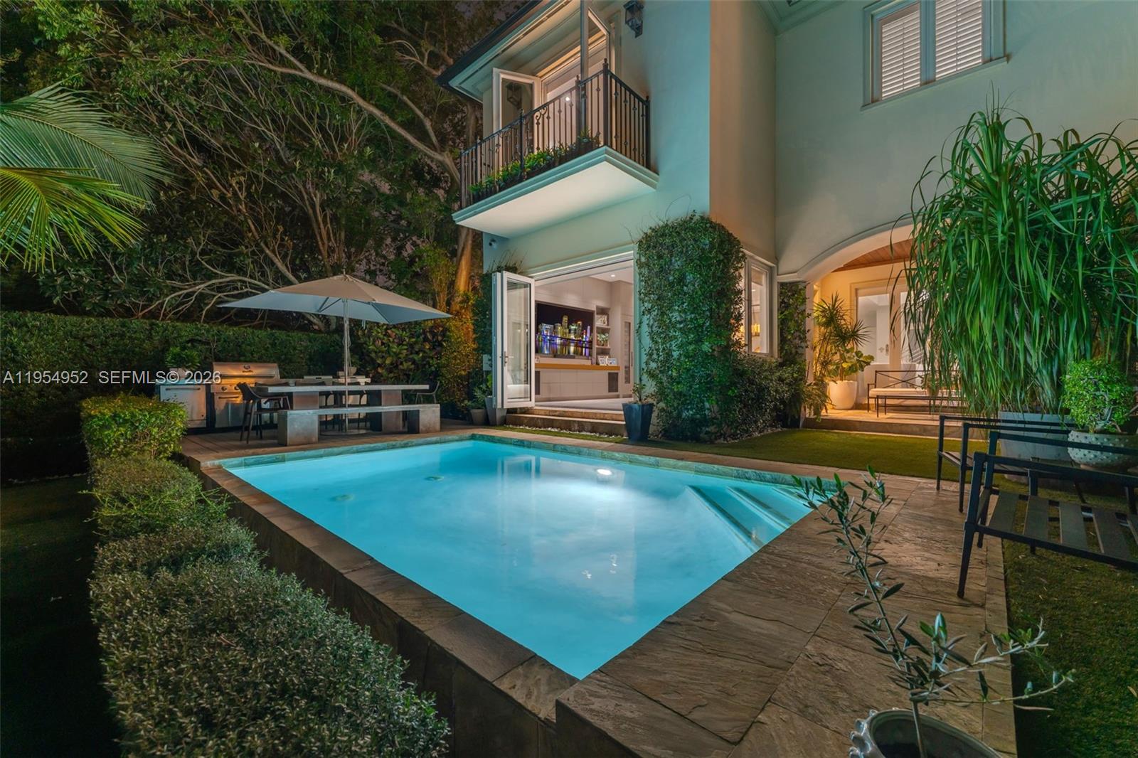 Welcome to 4819 University Drive, a bright & refined waterfront residence in the heart of Coral Gables, offering private dock access with direct ocean access for boaters. Designed for everyday living & entertaining, this home blends modern updates done in 2025 with over $400k in upgrades, & serene water views. The interior features porcelain flooring with wood finish, solid wood interior doors, & expansive living & dining areas filled with natural light. New Euro-Wall impact windows & folding glass doors create seamless indoor-outdoor flow to the waterfront terrace & pool. Linear slot diffuser A/C vents, LED recessed lighting, & surround sound enhance the contemporary aesthetic. The chef’s kitchen offers custom wood cabinetry, quartz countertops, all-new JennAir S/S appliances, & a Liebherr wine refrigerator with 75 bottle capacity. A private movie theater with seating for 7, built-in projector, & two wine coolers elevates the home’s entertainment experience. The primary suite features a fully remodeled 2025 bathroom with marble finishes & large walk-in closet. Outdoor living includes resurfaced pool completed in 2024, waterfront terrace, & Charbroil summer kitchen. Additional highlights include three A/C units, full indoor & outdoor camera system, Pelican whole-house water filtration, epoxy-finished garage with A/C, automatic custom blinds, updated septic system, & new gate motor. Ideally located near top-rated schools, parks, shopping, & dining. 5th Bedroom Used As Theatre.