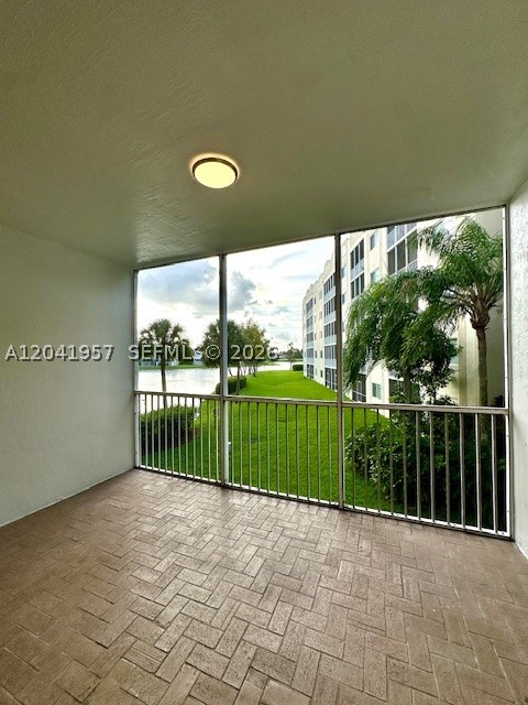 Discover one of the largest corner residences in the prestigious Captiva Condominium at Doral Isles. Offering an impressive 1,980 square feet of living space, this beautifully maintained condominium features 2 spacious beds, 2 full bathrooms, and a versatile flex room, ideal for a home office, media room, guest space, or additional living area.

Designed with comfort and functionality in mind, the residence offers an open and inviting floor plan with expansive living and dining areas, tile flooring throughout, abundant natural light, and a private west-facing balcony overlooking the lake, creating the perfect setting to enjoy breathtaking sunsets and peaceful water views.

This vacant, move-in-ready residence includes one assigned parking space and is located within a gated community with 24-hour security, offering privacy, tranquility, and an exceptional lifestyle.

As part of the highly desirable Doral Isles master-planned community, residents enjoy access to one of the finest resort-style clubhouses in Doral, featuring spectacular swimming pools, tennis and basketball courts, soccer fields, a state-of-the-art fitness center with an extensive selection of group fitness classes, children's playgrounds, scenic walking and biking trails, beautifully landscaped grounds, and an elegant clubhouse with a restaurant and social areas.

Located just minutes from Downtown Doral, CityPlace Doral, Miami International Mall, Dolphin Mall, Trump National Doral Golf Resort & more