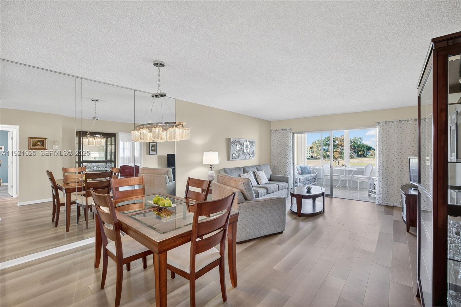 Beautiful and bright corner unit with 2 bedrooms and 2 bathrooms directly on the Oriole's Golf Course. Featuring new vinyl floors, this one will sell all furnished and turnkey with everything, ready to move in. Enjoy the Florida room with large windows showcasing stunning golf course views—overlooking the tee-off at hole 17 and the green of hole 18. Freshly painted shower & bathtub to add a clean, modern touch. New 2025 AC install ensures year-round comfort. UPdated kitchen with new countertop, flat ceiling & tiled baksplash. A rare opportunity to live with unbeatable views and contemporary upgrades throughout. HOPA-verified community with a sparkling pool, shuffleboard, sauna, fitness center, BBQ/picnic area, and more. Offer fully furnished and turnkey with some exclusions.
