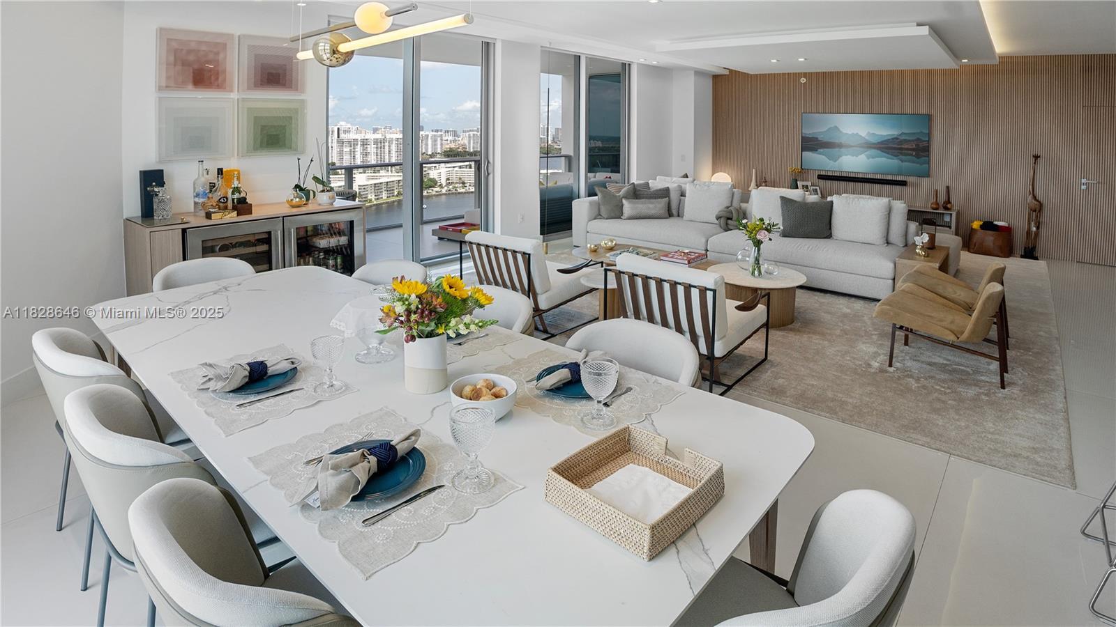 This extraordinary Marina Palms North Tower residence features 2 Bedrooms plus a Den converted into a 3rd Bedroom and 2.5 Bathrooms. Professionally designed by a renowned Brazilian architect, it showcases custom millwork with imported finishes from Brazil. A true Smart Home offers full Control4 automation for audio, video, shades, lighting, and climate. The chef’s kitchen is equipped with Sub-Zero/Wolf appliances, including a refrigerator, oven, microwave, coffee system, beverage center, and a 42-bottle dual-zone wine cooler. Thoughtfully upgraded for comfort, it includes a redesigned laundry area with LG Smart Wash Tower and utility sink, plus two custom office spaces with built-in standing desks. A one-of-a-kind blend of design, technology, and luxury waterfront living.