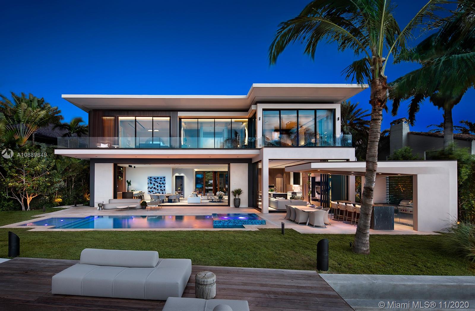 New waterfront mansion sited on the premier southern lot on Venetian Islands embodies the ideal combination of modern architectural simplicity, unobstructed Miami skyline views, & luxe amenities put together in an indulgent fashion. Dramatic entry with double-height ceilings leads to living areas with 12-ft ceilings, Boffi kitchen+chef's kitchen, family rm, dining area, entertainment bar, & living rm with auto doors. Top-of-the-line finishes, theater with state-of-the-art sound, Savant home-automation, Boffi fixtures, Porsche Design lighting. This masterful creation was brought to life with collaboration of multiple outstanding minds. Built by Ramin Designs, designed by Dunagan Diverio Design Group, staged by Artefacto, art curated by Fredric Snitzer Gallery.