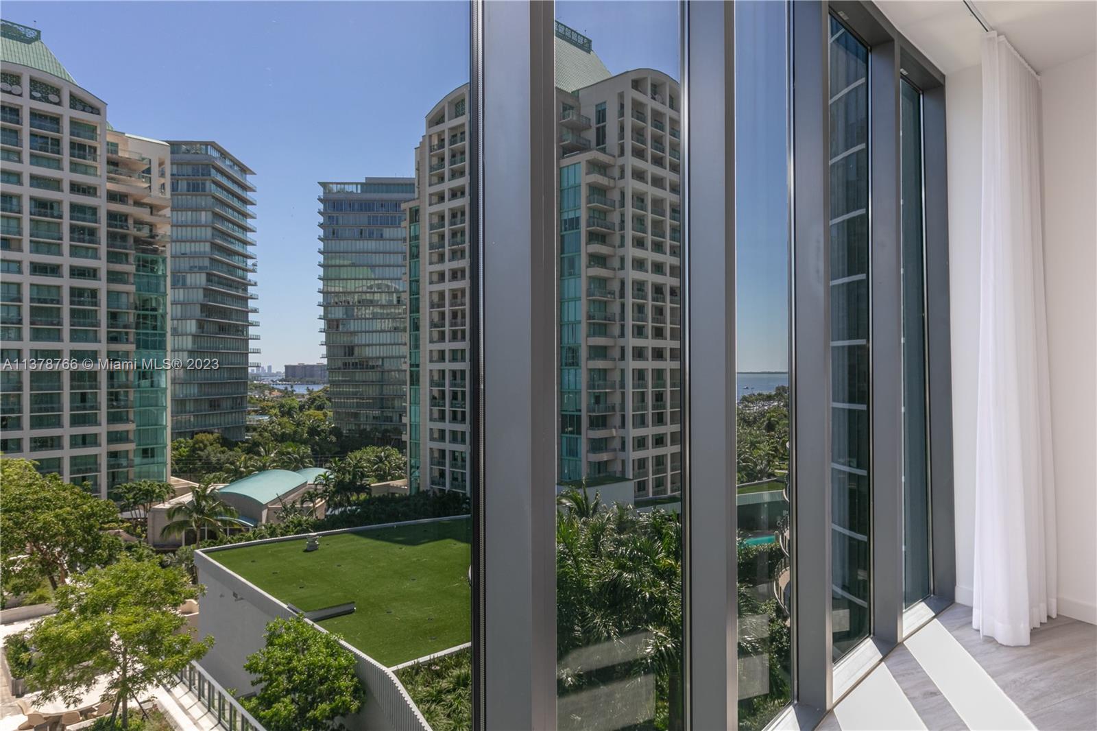 Live in luxurious splendor in Miami's most exclusive waterfront development. Located in coveted Coconut Grove facing Biscayne Bay & the marinas, this 2 bedroom/2 bath unit features 10 ft. high ceilings with 270-degree views overlooking Coral Gables, Coconut Grove, Miami skyline & bay. Unit has 2 private terraces, spectacular kitchen with Wolf and Subzero appliances, marble counters, and custom built in closets in bedrooms. Custom sheer blinds in all rooms & black outs in bedrooms. 1 assigned parking. Master has double shower & vanities. The Club Residences Tower has its own rooftop pool. Sitting on 6 waterfront acres the project has 550 feet of pools, unparalleled landscaping, amazing gym and spa, wine room and every amenity one desire. Walk to everything in the Grove! Amazing! Pets ok!