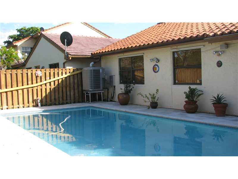 LOCATION LOCATION AT THE HAMMOKS, POOL HOUSE LOCATED ON THE GREEN BELT AND LAKE. ALL TILE THROUGH, REMODELED KITCHEN CABINETS,FRESHLY PAINTED, FORMAL LIVING,DINING, EAT IN KITCHEN PLUS AN IN LAW QUARTERS.WALKING DISTANCE TO WINN DIXIE SHOPPING CENTER. SEE  TO BELIEVE.