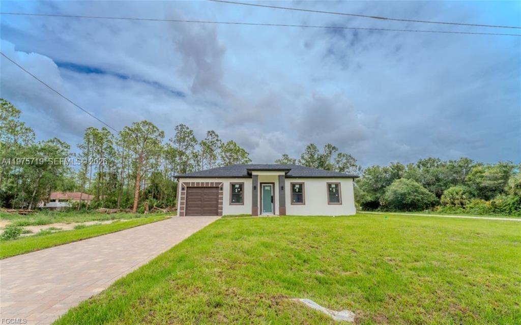 seller helping with closing cost!!! This beautifully designed 3-bedroom, 3-bath home is perfectly situated on an oversized corner lot, offering plenty of space inside and out. Featuring stylish tile flooring throughout, an open-concept layout, and high-end quartz countertops, this home combines comfort with modern finishes.

Enjoy the convenience of a paved driveway, a one-car garage, and a spacious yard with endless potential. Even better—the cleared lot next door is also available directly from the sellers, presenting a rare opportunity for expansion or investment.

Located in a quiet, natural setting with no HOA restrictions, this home is perfect for anyone looking for space, style, and flexibility.