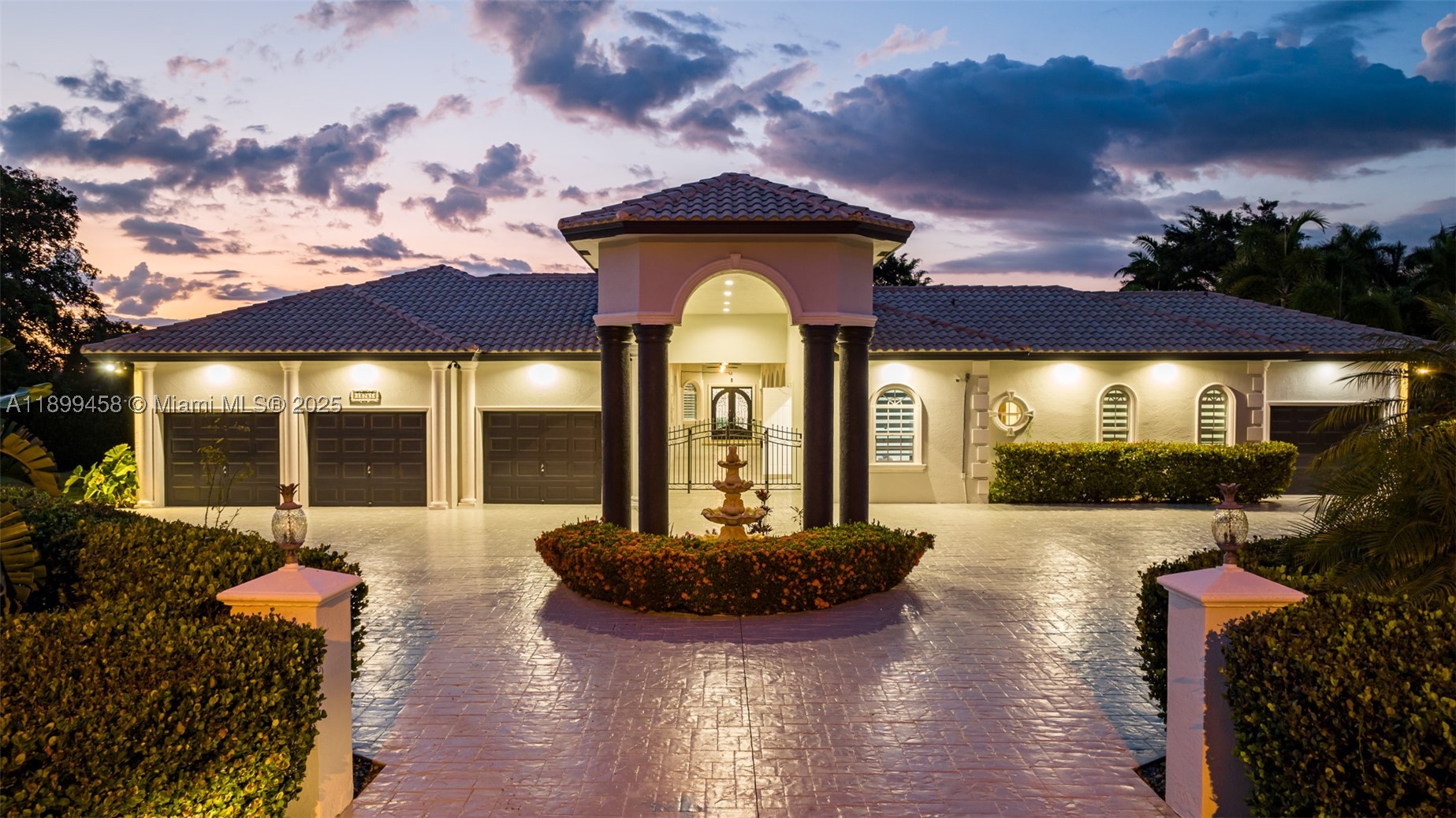 Most homes offer space—this one delivers scale, lifestyle, and presence at a completely different level. Tucked away on a quiet cul-de-sac in Davie, this impressive estate spans over 7,000 sq ft with 9 bedrooms and 7 bathrooms, designed for those who want room to live, entertain, and truly spread out.

From the moment you enter, soaring ceilings and expansive open living areas create a grand first impression. Natural light pours through the home, highlighting the scale of each space. The layout is thoughtfully designed for both everyday living and large gatherings, with a seamless flow between the chef’s kitchen, multiple living areas, and entertainment spaces.

This home is built for lifestyle. Enjoy a private cinema, game room, and dedicated gym, creating a full in-home experience without ever needing to leave. Every room feels oversized, every space intentional—perfect for large families, multi-generational living, or hosting at a high level.

Step outside and the property truly separates itself. The backyard is a resort-style retreat on a massive lot, featuring a heated pool, spa, hammocks, and a full BBQ area. The scale of the outdoor space is exceptional—offering privacy, openness, and the kind of setting that feels like a private resort. Whether entertaining guests or enjoying quiet nights under the stars, this is where the home truly shines.