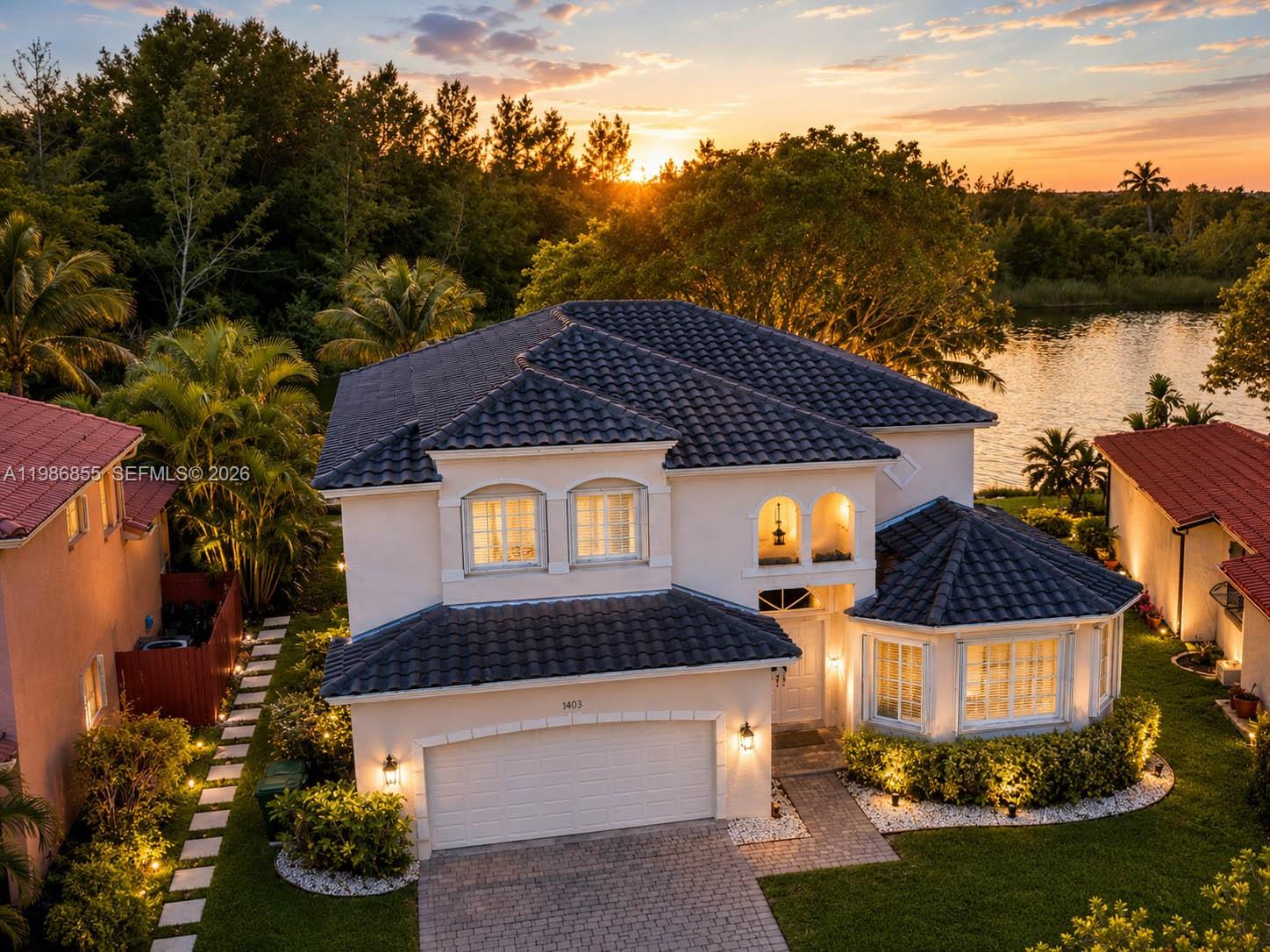 Wake up to peaceful lake views and unwind each evening with breathtaking sunsets right from your own backyard in the gated community of Keys Landing.  
This spacious two-story home is designed for both connection and comfort, offering 4 bedrooms, 3.5 bathrooms, and a versatile den or office; perfect for growing families, remote work, or creating the space you’ve always wanted.
Upstairs, the expansive primary suite becomes your private retreat, complete with generous his-and-her walk-in closets and room to truly relax at the end of the day. 
Downstairs, a full bedroom and bathroom provide the ideal setup for guests, in-laws, or even a quiet home office tucked away from the main living areas.
Step outside and imagine weekend barbecues, kids playing safely in the cul-de-sac, or simply enjoying the calm of the water and nature preserve views that make this home feel like an everyday escape.
With a newer roof (2022), accordion shutters for added protection, a modern security system, and fiber optic internet, you’ll enjoy both peace of mind and modern convenience.
Perfectly positioned near the Homestead-Miami Speedway, Homestead Air Reserve Base, the $280M Sports Hub that just broke ground and a variety of shopping and dining options, this home offers the balance of tranquility and accessibility that today’s buyers are searching for.
This isn’t just a home, it’s where your next chapter begins.