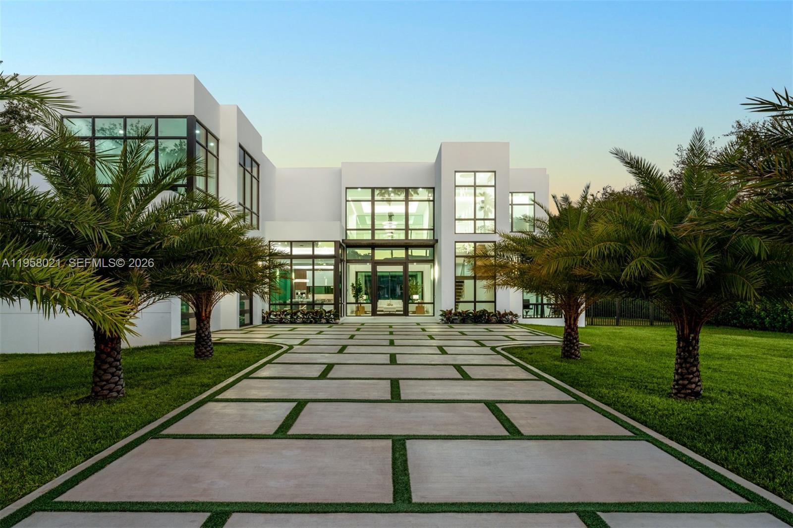 Experience refined comfort in this stunning two story residence set on a 30,840 SF lot. Double height ceilings and expansive open spaces are framed by floor to ceiling impact windows, filling the interiors with natural light and showcasing custom built ins and a well appointed home office. The ground level primary suite offers privacy and convenience. This 5 bedroom plus den or gym home opens to a private backyard retreat with a saline pool, jacuzzi, summer kitchen, and cabana bath. Spacious grounds allow room for a future guest house or sports court. Features include a built in Sonos sound system, dual laundry rooms, 2 car garage, and full home natural gas generator.