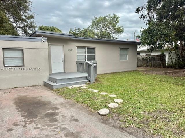 Beautifully renovated 3-bedroom, 2-bath home featuring a spacious backyard, screened patio, and two storage units.
