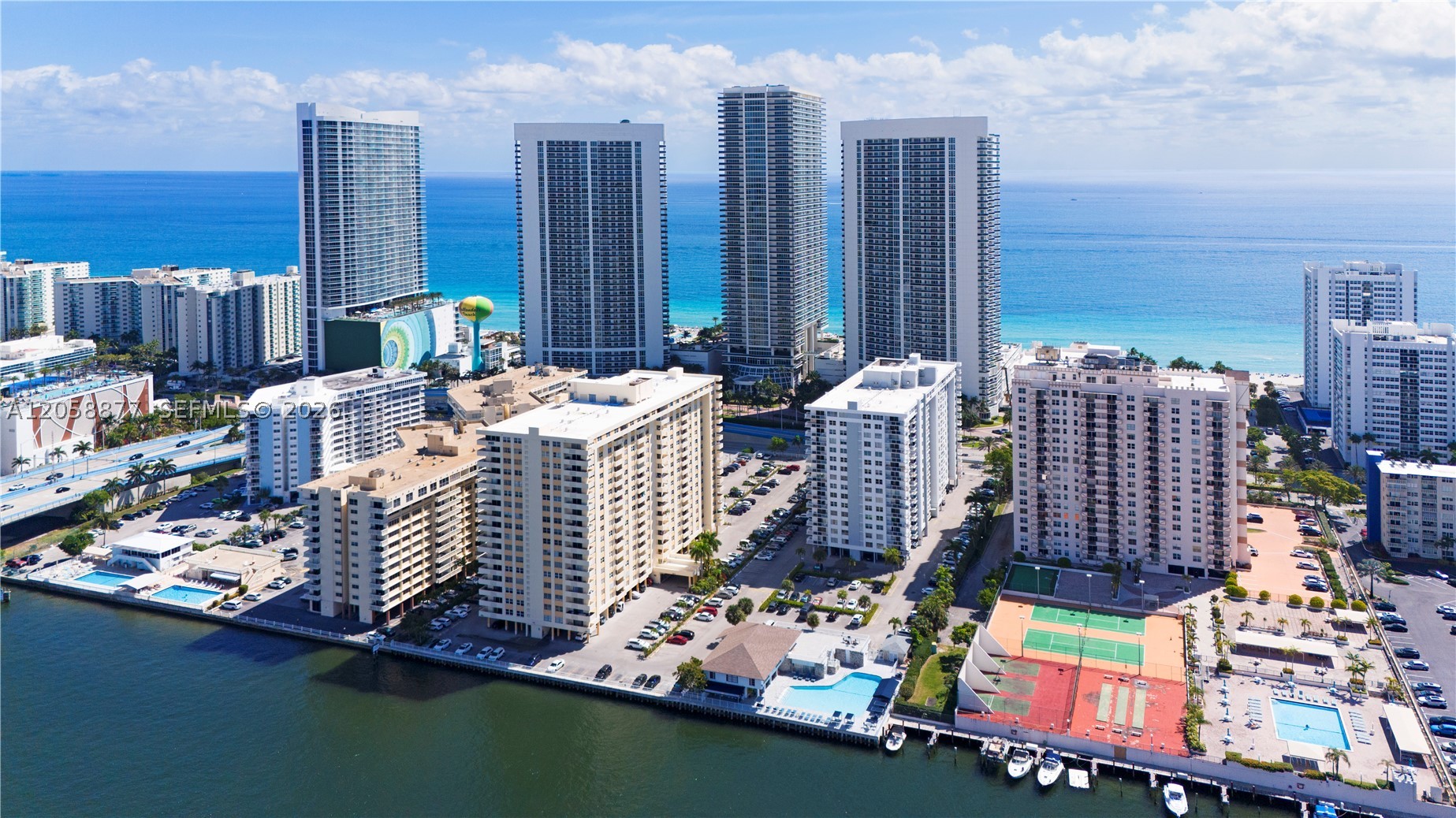 STUNNING REMODELED BEACHFRONT UNIT – 2 Bedrooms / 2 Full Bathrooms with walk-in closets. Impact Windows and Doors throughout. Modern kitchen with New Cabinetry, dishwasher, and full-size refrigerator. New A/C. Smooth Ceilings (no popcorn). Breathtaking Intracoastal views with yacht parade. Low-maintenance HOA includes Internet, Water, Pest Control, and Insurance. Resort-style amenities: Heated Pool, Gym, Sauna, Billiards room, and Clubhouse. Assigned Parking, Car Wash area, Personal Storage, and 24/7 Secured Electronic Gate entrance. Building has passed its 50-year certification — No assessment. New Roof, Exterior Paint, and Remodeled Hallways. Walking distance to The Beach and Parks. Nearby Banks, Restaurants, Walmart, Publix, Gyms, and Top-rated Schools. Motivated Seller — Bring All Offers!