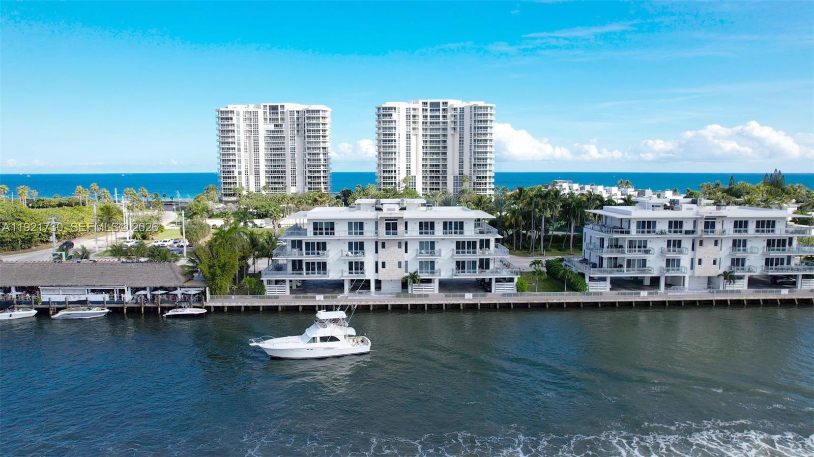 Boater’s Paradise in Hollywood’s North Beach! This north corner unit in Seaside Village is one of only  exclusive  5-unit building with a deed dock. Enjoy panoramic ocean-to-Intracoastal views with four balconies, one off every room. With direct Intracoastal views and ocean access with no fixed bridges, this unit has floor-to-ceiling windows offering spectacular views.  A private elevator foyer entry leads to a spacious 3-bedroom, 3.5 bath residence.  Each bedroom is an En-suite with private balcony , full laundry room,  designer appliances , expansive custom walk-in closet and hurricane impact windows.. Includes 2 covered parking spaces, guest parking, and a large private storage unit. The gated community features a fully equipped private marina with water/electric. Centrally located between Miami & Fort Lauderdale, just minutes to FTL Airport.  Boat slip may be rented or sold to another homeowner, offering added flexibility and value. Approximate slip value is $250,000. Perfect for boating enthusiasts seeking convenient water access and premium waterfront living.