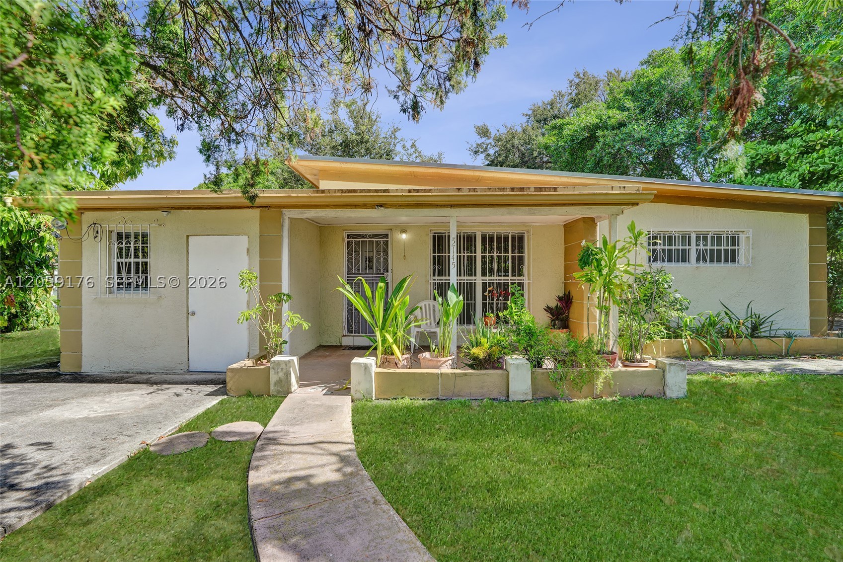 Great opportunity to own a home situated on a spacious corner lot with mature trees that provide an abundance of shade. Public records reflect the property as a 2-bedroom, 1-bathroom home. The property also features a separate  area with a private entrance, bathroom, and front and rear access, offering flexible space for a home office, guest area, or additional storage. This home offers wonderful potential for a buyer to personalize and make it their own. The oversized corner lot provides additional outdoor space and possibilities for future enjoyment. Conveniently located near major highways, shopping, schools, and other local amenities. With its desirable location, generous lot size, and flexible living space, this property offers a unique opportunity that is sure to attract attention. Schedule your showing today and discover the possibilities this home.