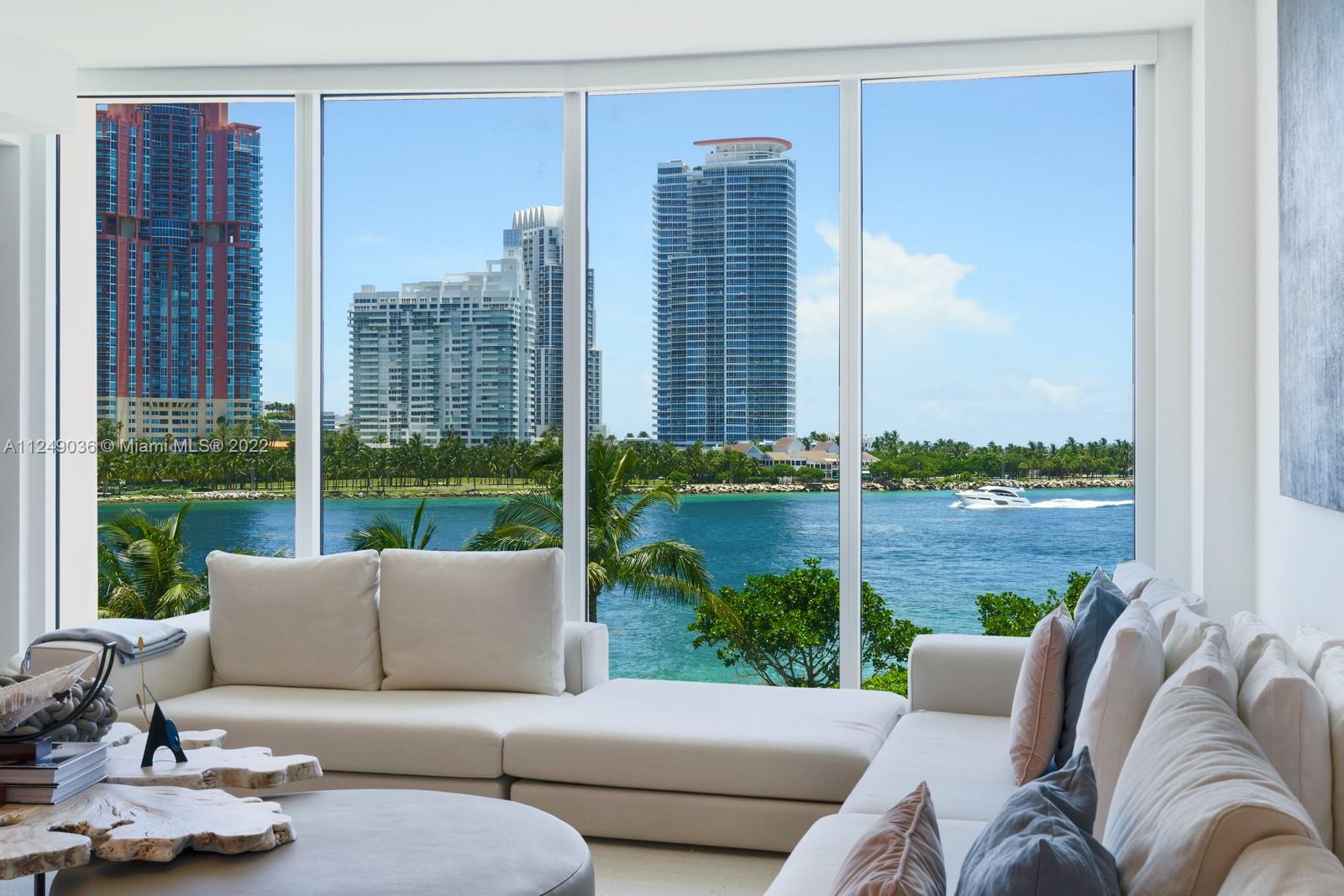 East facing, 3 bedroom, 3.5 bath with sparkling ocean views from Fisher Island’s newest and most desirable building, Palazzo Della Luna. This flow-thru unit, with East to West facing balconies, has 10-foot floor-to-ceiling windows. A ready, turn-key haven is professionally designed and furnished, with built-in closets throughout. The custom, craned-in, 16-foot white Statuary Marble countertop is a focal point in design in the Boffi gourmet kitchen. Miele, SubZero Refrigeration, and Wine Cooler round out the utmost in luxury and modern living. 6835 comes with the largest available storage room, two prime parking spaces outfitted with Tesla Charging stations, and 2 Garia golf carts. PdL is a full-service building with countless new amenities not found anywhere else on the island.