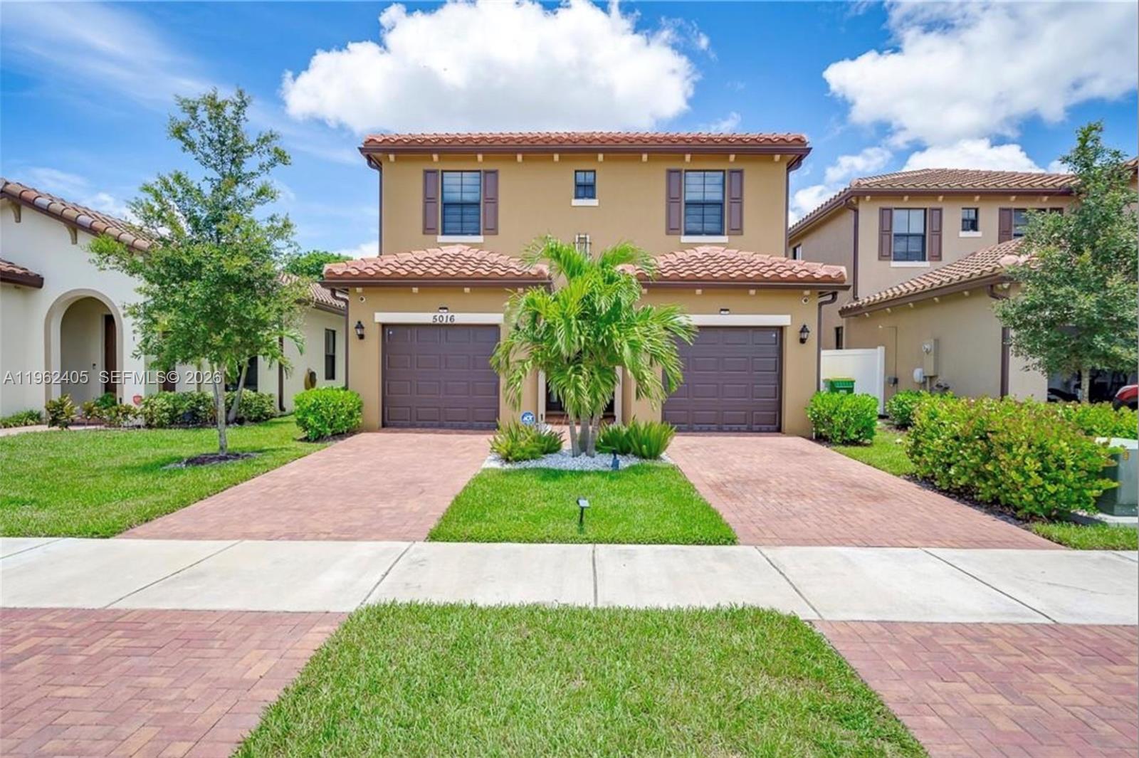 Stunning contemporary 4-bedroom, 3.5-bath home offering 2,267 sq ft of thoughtfully designed living space and upscale finishes throughout. Fully tiled with large-format Italian porcelain, this home features soaring ceilings, a custom quartz staircase, and a built-in media wall with digital fireplace and stone mosaic accent. The open-concept kitchen flows seamlessly into the main living areas, perfect for entertaining. Enjoy two spacious suites, including a luxurious primary retreat, plus two additional bedrooms and an upstairs utility room for convenience. Step outside to a backyard designed for gatherings with extended pavers, pergola, and a custom outdoor kitchen/grill area. Full impact windows and doors, whole-house water treatment system, and two separate garages complete the package. Modern style, comfort, and functionality all in one exceptional property.