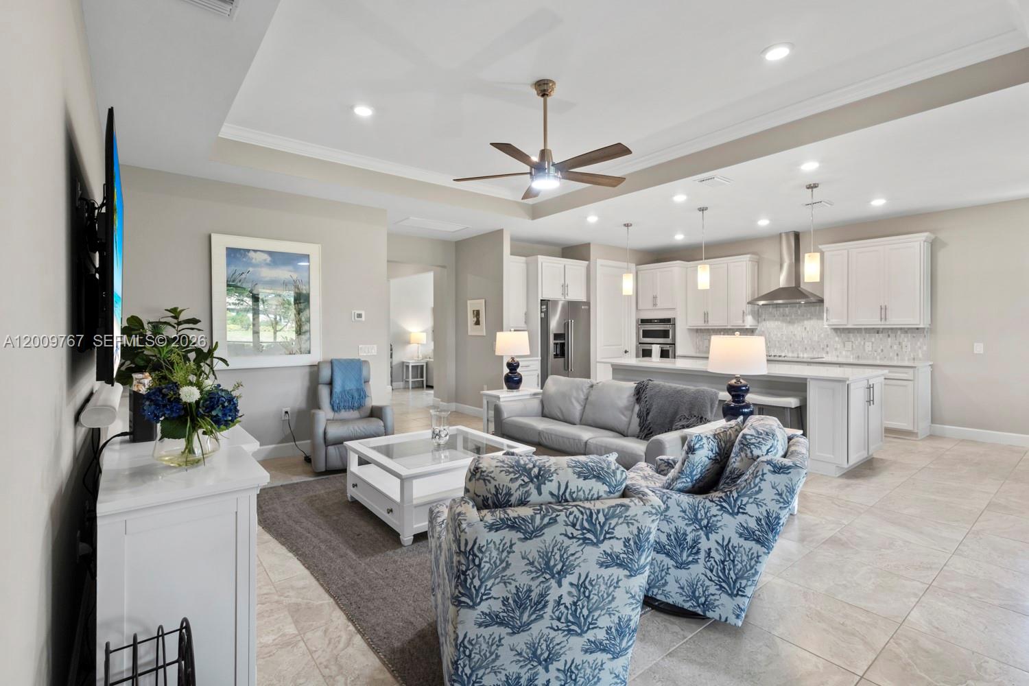 JUST REDUCED! Enjoy a WATERVIEW in this PRESTIGE FLOOR PLAN located in the 55+ Del Webb community, offering 2 BEDROOMS + Den (with closet), 2.5 BATHS, and the perfect blend of luxury, comfort, and Florida lifestyle living. Open-concept layout enhanced by TILE FLOORING THROUGHOUT and abundant natural light. The thoughtfully upgraded KITCHEN serves as the heart of the home, featuring SOFT-CLOSE CABINETRY, convenient PULL-OUT DRAWERS, GRANITE COUNTERTOPS, and a CUSTOM PANTRY designed for both beauty and functionality. The spacious gathering areas flow seamlessly for everyday living and effortless entertaining. The expansive PRIMARY SUITE is a true retreat, complete with an EXTENDED WALK-IN SHOWER and TWO LARGE WALK-IN CLOSETS, including one custom-designed for optimal organization. A private GUEST EN-SUITE provides comfort for visitors, while the additional DEN with a closet offers flexibility as a home office, hobby room, or extra sleeping space. A convenient HALF BATH is perfectly positioned for guests. Enjoy peace of mind with IMPACT WINDOWS AND DOORS, and take advantage of the 4' GARAGE EXTENSION offering valuable additional storage or workspace. The GARAGE is further enhanced with an EPOXY FLOOR and OVERHEAD STORAGE. Custom blinds, extra CLOSET SPACE and thoughtful upgrades throughout complete this exceptional residence. The BACKYARD showcases peaceful water views and offers ample space to add a pool, creating the perfect setting for outdoor relaxation and entertaining.