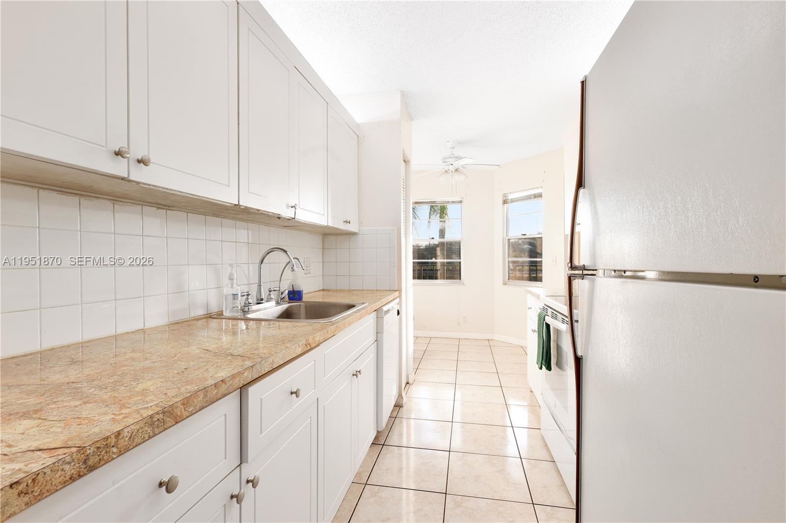 Here is a great opportunity to own a 2/2 in the desirable Buckingham East at Century Village! This unit is ready to customize and make your own. Featuring spacious bedrooms with large walk in closets, eat-in kitchen, an in unit washer and dryer, 1 assigned parking space with plenty of guest parking and a beautiful serene view over looking the pool area. This community has tons of amenities including a state of the art club house, theatre, pools, walking paths, golf, shuffle board, pickle ball, tennis, free shuttle bus and gated manned security. All designed for a comfortable, convenient, active 55+ lifestyle! Association requires a minimum 700 credit score. Easy to show!