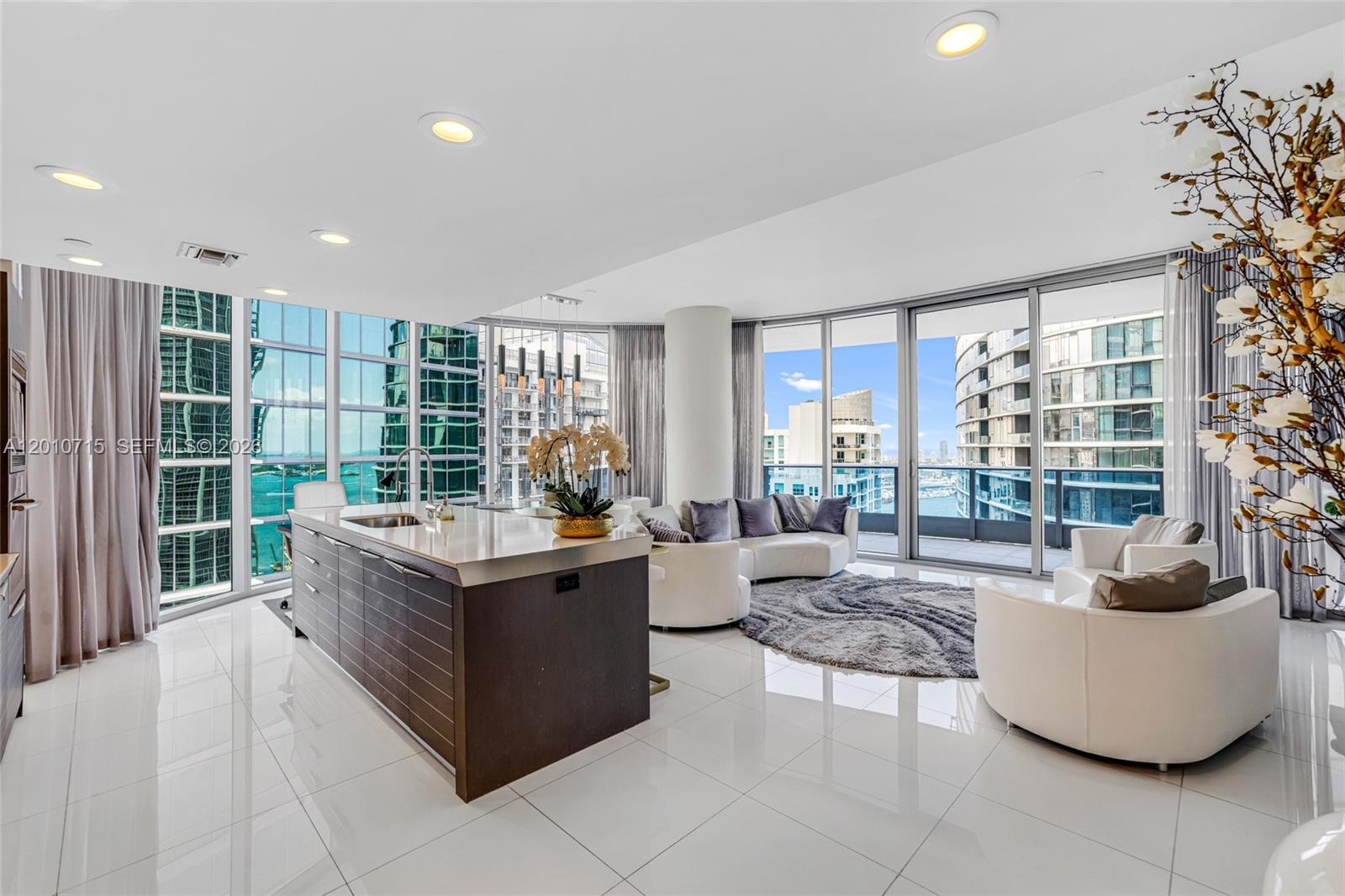 Experience elevated waterfront living at EPIC Miami in this desirable corner 2BD/2.5BA, one of the best lines in the building. This designer decorated, turnkey residence features oversized floor to ceiling windows that fill the space with morning and afternoon light, showcasing beautiful water and city views. A spacious balcony and elegant open kitchen with built in top of the line appliances complete the home.
Thoughtfully furnished with Italian pieces, the residence includes custom made remote control shades and blackout shades in the bedrooms.
Residents enjoy resort style amenities including three pools, full service spa, fitness center, 24/7 concierge and valet, marina access, beauty salon, and on site dining at Zuma and Area 31, plus access to Kimpton hotel amenities. Fantastic central location.
Includes 1 assigned parking space and storage.