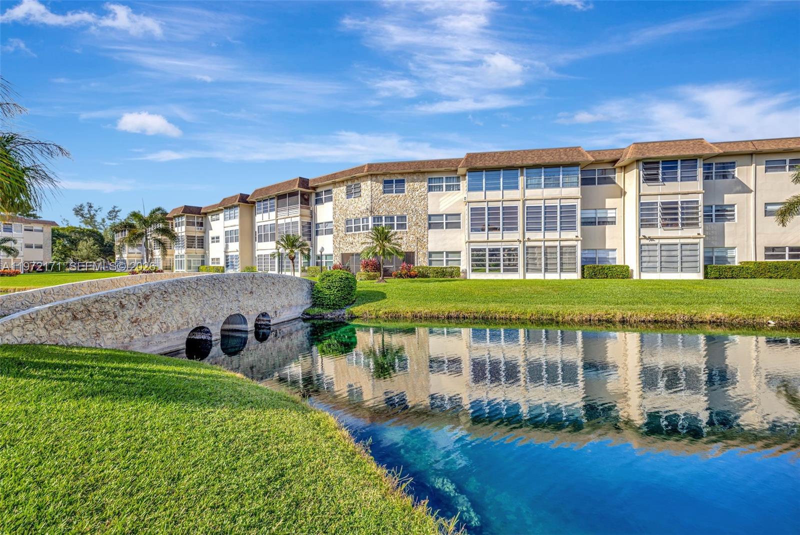 Beautiful 2-bedroom condo located on the second floor featuring a Florida room with breathtaking lake views. Open-concept kitchen, full ceramic flooring throughout, fully furnished with new electrical panel and new water heater.Gated community with pool, shuffleboard, BBQ area, gym, and library. Prime location near restaurants, stores, and the Turnpike.
