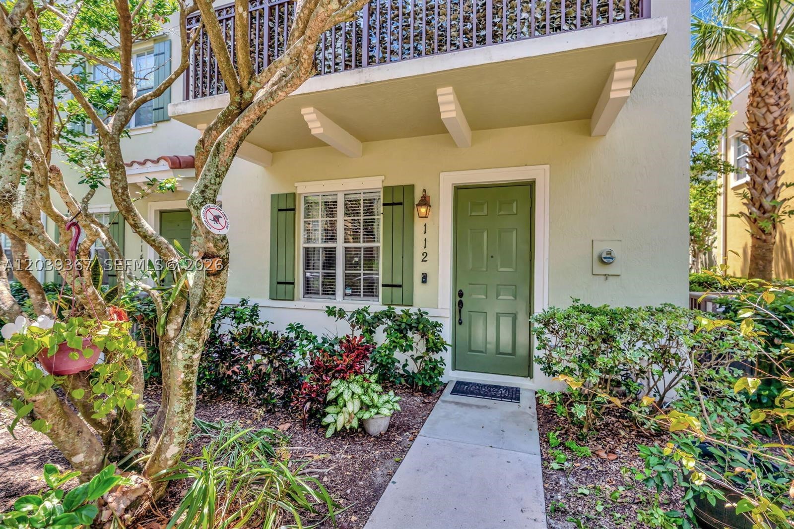 Discover the best of Abacoa living in Osceola Woods, a sought-after townhome community known for its charming tree-lined streets, lush walking trails, and unbeatable walkability to Downtown Abacoa. This beautifully maintained corner townhome offers 3 bedrooms plus a flex room, 3.5 baths, a 2-car garage, and nearly 2,000 sq. ft. of inviting living space. The open eat-in kitchen features recently updated marble countertops, subway tile backsplash, stainless steel appliances, pantry, serving bar, and a large single-bowl undermount sink. The spacious primary suite includes a walk-in closet and spa-style bath with dual sinks, soaking tub, and separate shower. Guest rooms are generously sized, including an additional bedroom with private en-suite bath. Enjoy neutral tile and laminate wood flooring throughout, plus a private open-air balcony overlooking serene garden views. Major updates include a NEW 2024 roof and 2021 exterior paint. Community amenities include a clubhouse, heated pool, playground, walking trails, and green spaces. Just a short stroll to restaurants, coffee shops, Roger Dean Stadium, festivals, fitness studios, and more. Zoned for A-rated schools, less than 15 minutes to Jupiter beaches, near golf, and close to major highways. Live the Abacoa lifestyle!