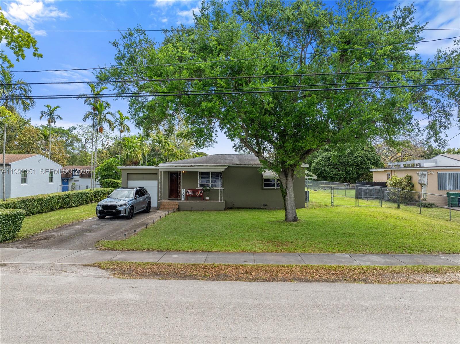 A rare opportunity to own your private piece of paradise in the desirable Biscayne Gardens neighborhood - set on over half an acre of land with exceptional flexibility and future potential.

This charming, move-in ready residence welcomes you with a bright open layout, generously sized bedrooms, and thoughtfully designed living spaces that flow seamlessly outdoors. Two covered patios create a perfect setting for entertaining, relaxing, or enjoying the Florida lifestyle year-round.

The secondary patio and garage structure present a unique value-add opportunity - easily convertible into a pool house, guest suite, or additional living space tailored to your vision.

Positioned on a 0.57-acre lot, the property offers ample room to expand, redesign, or build a custom estate. Located within unincorporated Miami-Dade, short-term rentals such as Airbnb are permitted — making this not only a beautiful home, but also a compelling investment with income potential.

Conveniently located near I-95, major roadways, parks, and Florida International University, while still offering privacy and space rarely found in Miami.

Whether you are looking to live, invest, or create something truly special — this property offers a foundation with limitless potential.

Schedule your private showing today.  Some of the photos are artistic renderings.