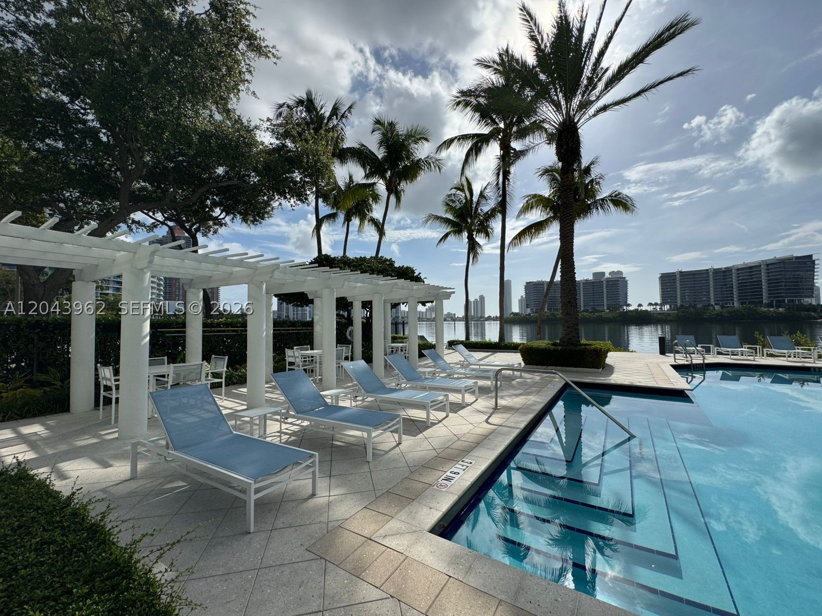 Mediterranean-style waterfront pet-friendly community with bay views and canal access, residents enjoy resort-style amenities including 2 pools, a jacuzzi, tennis courts, a fitness center, yoga room, clubhouse, theater, party room, business center, BBQ areas, and 24-hour gated security. With short-term rentals permitted, this property is well suited as a primary residence, vacation home, or investment opportunity. Move-in ready fully furnished, has in-unit washer & dryer, 2-bedroom, 2-bath ground-floor residence offers comfort, style, and flexibility in the heart of Aventura. features 9-foot ceilings, porcelain flooring, and an open-concept kitchen with granite countertops & breakfast bar, stainless steel appliances, Big Master Bedroom with spacious walk-in closet and oversized bathroom with a soaking tub, has a serene garden setting and assigned covered parking plus guest parking.   ASK ABOUT LEASE OPTION TO BUY   OR SELLER FINANCING   LET'S MAKE A DEAL !!!