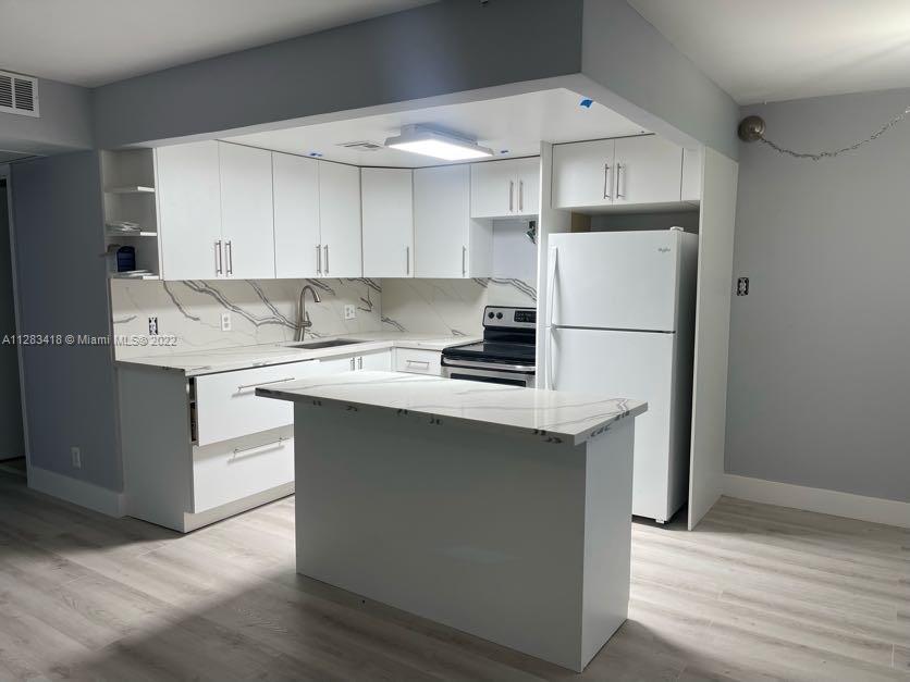 Remodeled First floor unit with Beautiful water views.  2 bedroom 1 and 1/2  bath was. Century Village has a remodeled clubhouse with lot of recreational options to enjoy. Conveniently located close to Pembroke Shoppes, I-75 and Turnpike