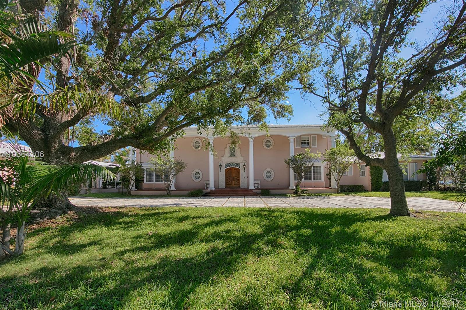 This Classic bayfront 6 BR family home on over 3/4 of an acre w/ 190 FT of water frontage & endless views of downtown & Miami Beach awaits your customization. 1st floor includes a grand 2 story entry foyer with dual winding marble staircases, oversized entertaining areas w/ high ceilings, paneled library, guest suite w/ bay views, loggia leading to rec room overlooking pool, maids room & 2 car garage. 2nd floor features 4 immense ensuite BR's w/ walk-in closets. This grande dame of Bay Point should not be missed.