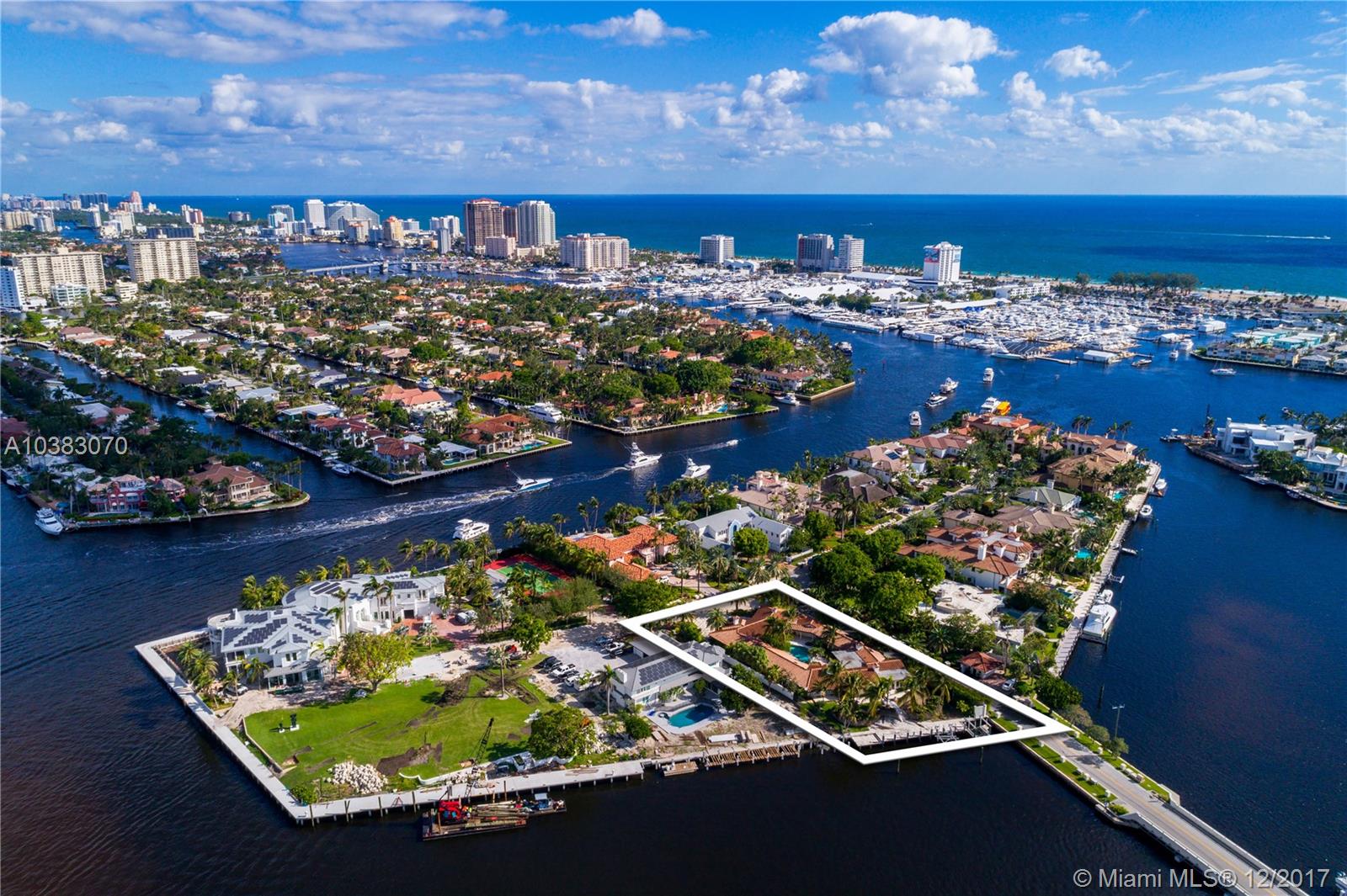 One of the last opportunities on the exclusive Harborage Island to build the home of your dreams or remodel the current structure. 24 hour guard at gate with only 16 homes on this Prestigious Island. The home sits on a 22,686 SFT. lot and has 110' of deep/wide water frontage and Intracoastal views. Dock your yacht behind your home with quick ocean access.