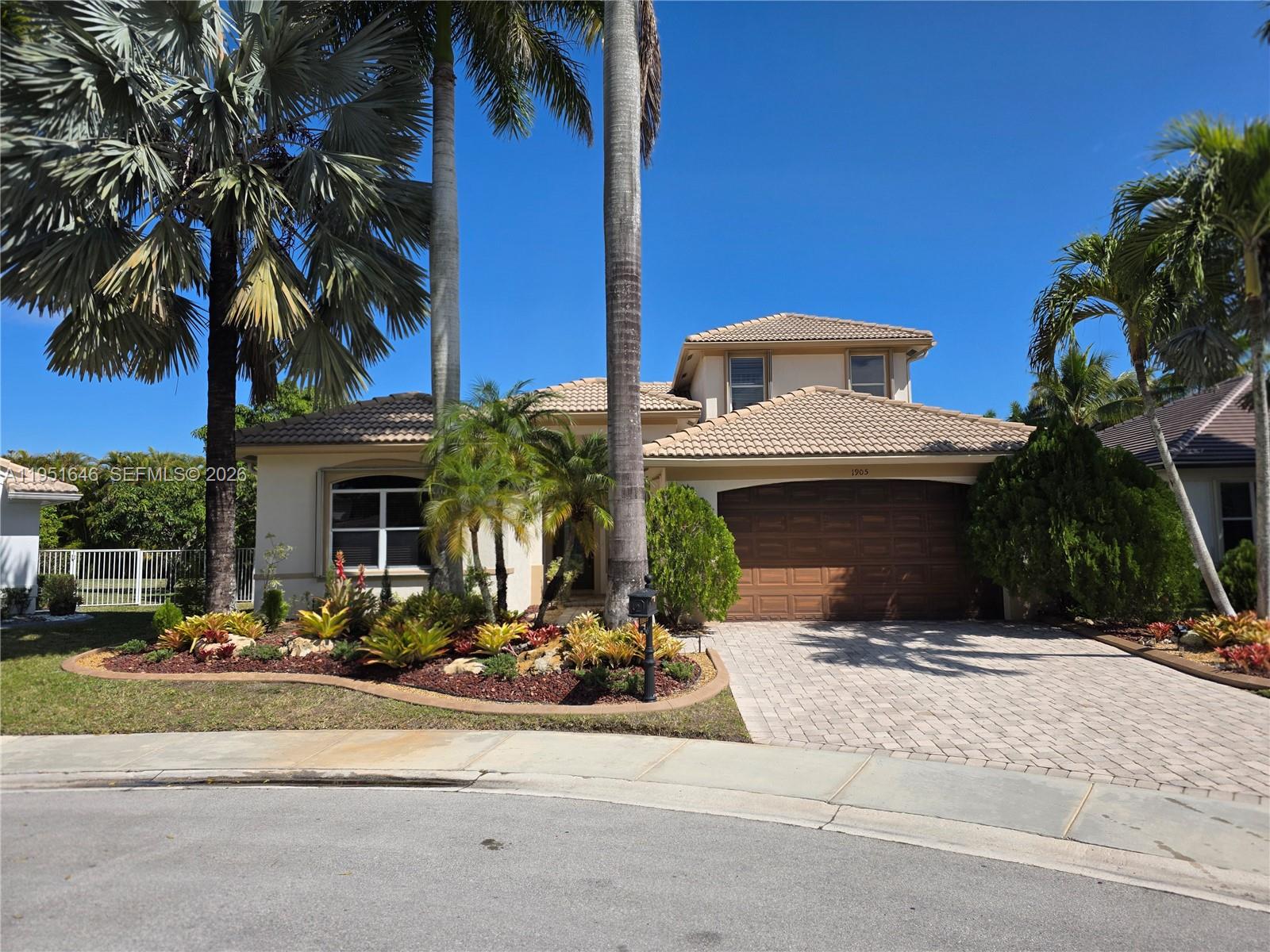 Located in the prestigious Weston Hills Country Club, this  6-bedroom, 4-bath home sits on a private cul-de-sac and offers the perfect blend of elegance and comfort. Bright, open living spaces flow into a modern kitchen with updated finishes, ideal for everyday living and entertaining. Enjoy a resort-style pool with cascade waterfall, lush landscaping, and a private backyard oasis on oversized lot. Spacious bedrooms provide flexibility for guests, home office, or multi-generational living. Guard-gated community with optional country club membership featuring championship golf, tennis, clubhouse, and pool. Zoned for A-rated schools and close to parks, shopping, and major highways. A rare opportunity in one of Weston’s most desirable communities.