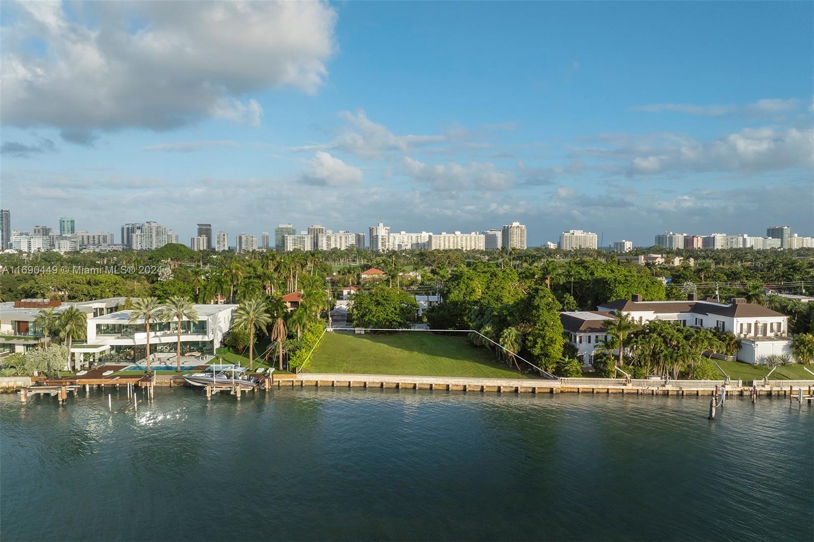Set on one of the last large waterfront parcels in Miami Beach’s prestigious North Bay estate section, 5840 N Bay
Road presents a rare and remarkable opportunity to craft a legacy residence in an exclusive enclave. With 150’ of
unobstructed bayfront views, direct sightlines to the Miami skyline, and a readiness for a multi-structure estate of
up to 13,587 SF+/-, this land offers an extraordinary canvas for luxury living. Envisioned for the most discerning
buyer, this property combines the elegance of North Bay Road with modern Miami vibrancy—ready to become a
private, luxurious escape that captures the true spirit of Miami Beach.