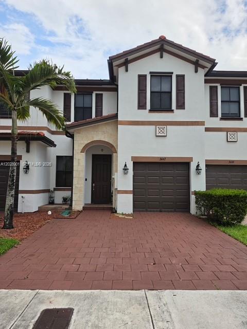 Beautiful townhouse located in the gated community of Aquabella. This well-maintained home features porcelain tile flooring throughout and a fully tiled backyard, providing a low-maintenance outdoor space ideal for entertaining and family gatherings. Enjoy access to resort-style community amenities, including a clubhouse with a large swimming pool, fitness center, children's playroom, and kiddie pool. Conveniently located near major highways, shopping, dining, and schools. A great opportunity to own in one of the area's most desirable communities.