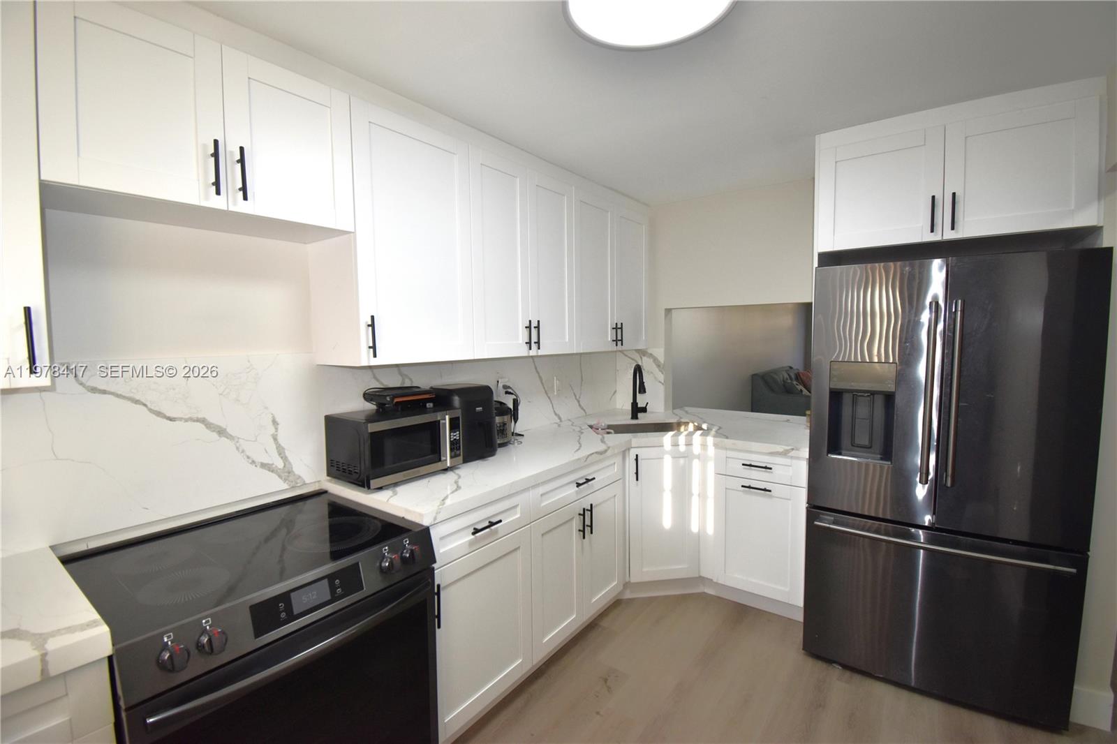 Completely renovated and move in ready first floor location 2 bedroom 2 bath condo offers a , full size washer and dryer inside the unit ,renovated kitchen with newer appliances , fully renovated bathrooms , newer light fixtures throughout , newer flooring throughout and screened porch. All ages and pet friendly  community includes, 2 pools, Gym, tennis court, community center, a BBQ area, and plenty of parking space. Association fees includes exterior building Insurance, water, trash & sewer, landscaping, and pest control. The building has passed the 40 yr certification. No special assessments or credit score requirements as per Association. The development has reserves .