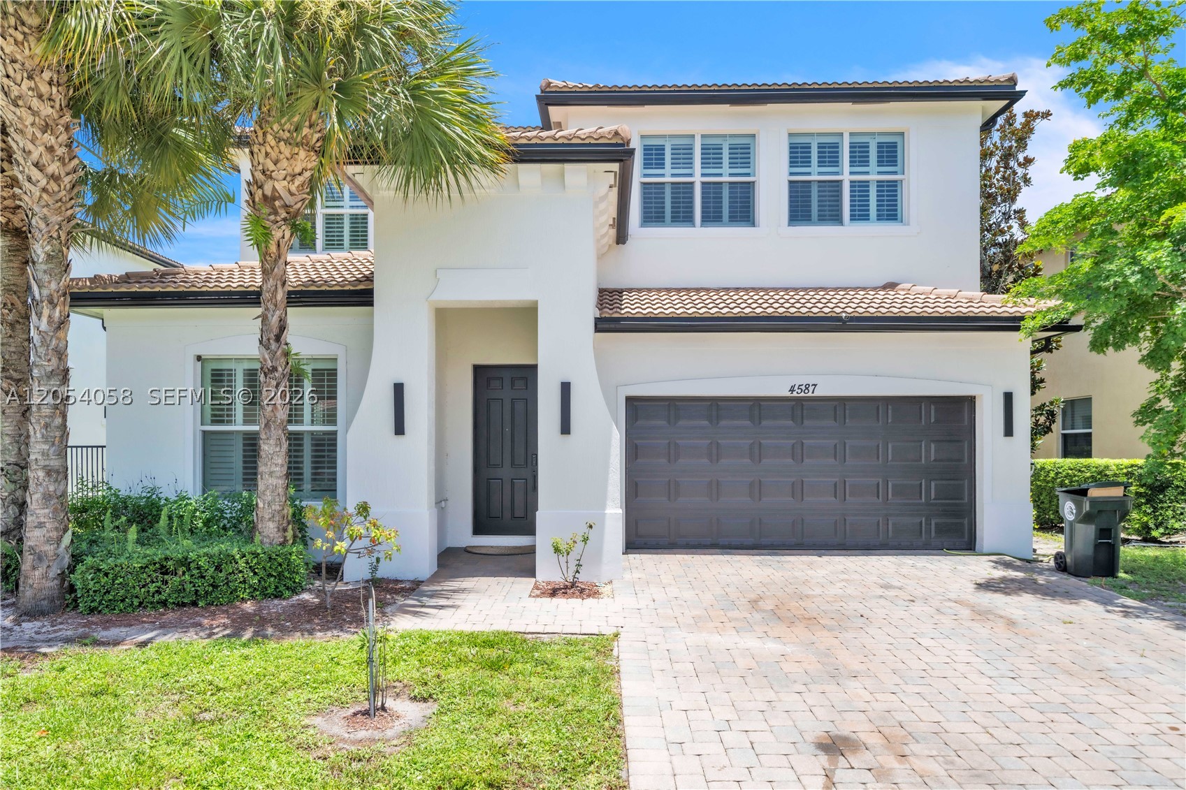 Welcome to San Mellina, one of Coconut Creek’s most desirable gated communities! This beautifully maintained waterfront residence offers 5 bedrooms, 4 bathrooms, and a spacious open loft with the potential to be converted into a 6th or even 7th bedroom, making it ideal for growing families, multigenerational living, or flexible work and entertainment space. The open-concept floor plan features 36” porcelain tile throughout the main living areas, impact windows and doors, plantation shutters, and a chef’s kitchen with double wall ovens, abundant cabinetry, and generous counter space. A first-floor guest bedroom and full bath provide added convenience, while the second floor offers the luxurious primary suite, additional guest bedrooms, and the expansive loft. Enjoy your private lakefront backyard with a heated pool, oversized spa, automatic chlorination system, covered patio, and extended travertine deck. Recent improvements include a new refrigerator, dishwasher, washer, dryer, premium second-floor carpeting (approx. $14,000), and fresh interior paint (approx. $8,000). Conveniently located near The Promenade at Coconut Creek, top-rated schools, shopping, dining, and major highways. High-quality furnishings are available for purchase separately. Move-in ready and meticulously maintained!