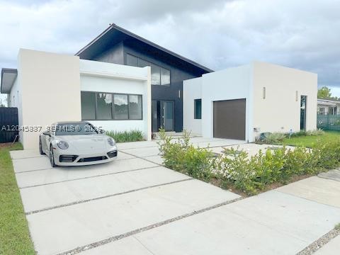 Experience the ultimate in modern luxury with this one-of-a-kind residence, offering
2,600 sq. ft. of living space thoughtfully designed for elegance and comfort. Built with
solid concrete construction, this home combines durability with contemporary style.
Inside, you’ll be greeted by soaring 22-foot ceilings that create a breathtaking sense of
space and sophistication. The home features 4 spacious bedrooms and 3 beautifully
designed bathrooms, perfect for both family living and entertaining guests. Enjoy a
modern gourmet kitchen featuring custom wood cabinetry and a stunning Taj Mahal
Quartz countertop, perfectly blending beauty with durability. The expansive living
areas flow seamlessly into the outdoors, where you’ll find your private terrace with a
sparkling pool, the perfect retreat for relaxation or gatherings. A secure garage adds
convenience and peace of mind. This property is not just a home—it’s a lifestyle. With
its luxurious finishes, unique architectural design, and resort-style amenities, it offers
the perfect blend of comfort, beauty, and exclusivity.