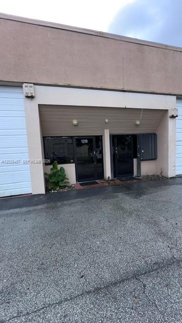 Excellent opportunity! Rental for a small business . Open or relocate your business to this perfect 590 sq ft warehouse with an additional 140 sq ft loft in the busy industrial and commercial areas of the  Kendall Business district. The warehouse has a loft office space for an office or additional showroom space, bay door 12 ft high, all under 100% AC, private bathroom, Storefront window and glass door entry, commercial carpeting, unassigned parking spaces, extra street parking available. Think, Accounting firm, medical therapy, real estate office, flooring showing room, carpentry, small distribution center, make-up artist, designer, artist and so much more.  No auto related businesses. Offered at $1600 per month.  First, last and security required. Association approval required, along with credit history, background and financials.