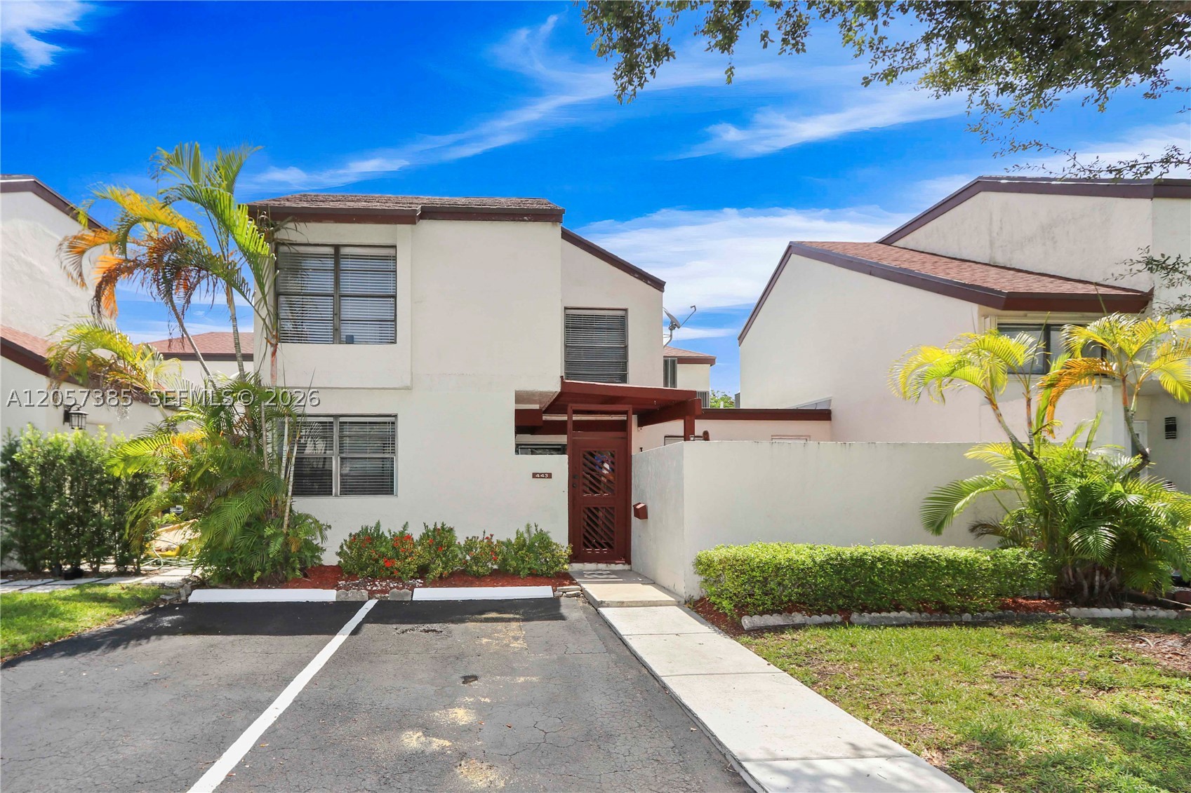 Beautifully maintained 2-story townhome located in the highly desirable gated community of East Wind Lake Village in the heart of Fontainebleau. This move-in-ready residence features a bright and functional floor plan with spacious living areas, generously sized bedrooms, updated bathrooms, laminate flooring on the upper level, abundant closet space, and a convenient in-unit laundry area. The neutral finishes throughout provide the perfect canvas to make this home your own. Residents enjoy a family-friendly community with two swimming pools, tennis courts, and a children’s playground. Ideally situated near top-rated schools, shopping, dining, Florida International University (FIU), Dolphin Mall, Miami International Airport, and major expressways, offering exceptional convenience for everyday living. A fantastic opportunity to own in one of Miami’s most centrally located and sought-after communities.