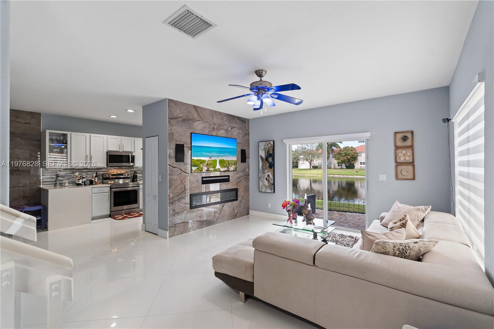 Just bring your belongings and start enjoying the South Florida lifestyle in this beautiful corner-unit home featuring 3 bedrooms and 2.5 bathrooms. Filled with natural light, the property offers impact windows and doors throughout, creating a bright living environment. Extended tiled patio is perfect for outdoor entertaining, weekend BBQs, or simply relaxing and enjoying the Florida sunshine. Fully remodeled kitchen has been thoughtfully designed with modern finishes and functionality in mind. Tastefully decorated with a combination of stone accents and hardwood floors, this home also features Two car garage to keep with wheels protected. A brand-new washer and dryer add everyday convenience. Located in a quiet, well-maintained community with low HOA fees. This community is situated in an area experiencing carefully planned growth, with shopping, dining, and major roadways just minutes away.