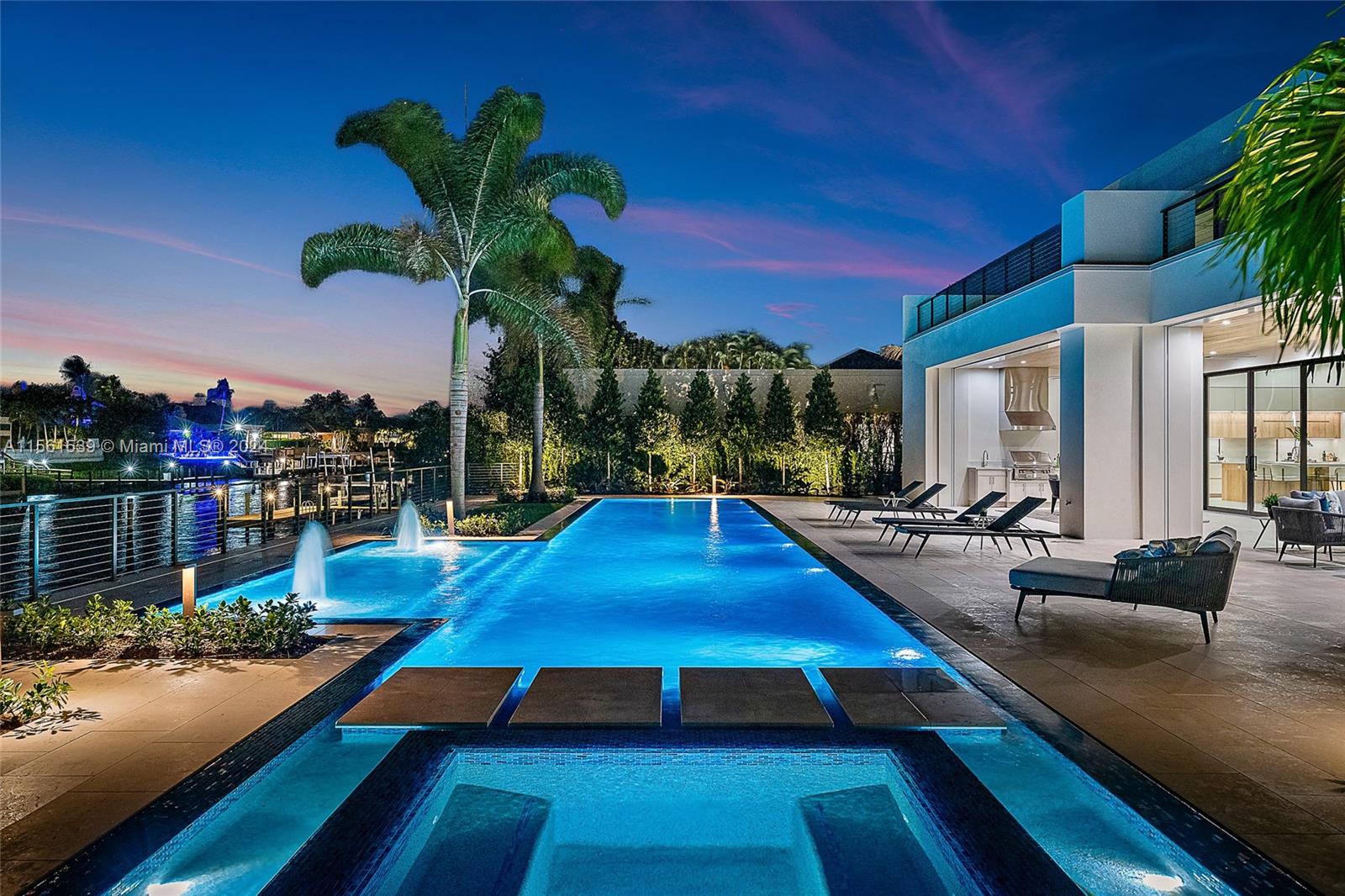 Welcome to 410 Mariner Drive, a contemporary waterfront masterpiece in the prestigious enclave of Admirals Cove. Featuring 7,998 sq ft of interior living space and a total living area of 12,253 sq ft, this new build seamlessly blends modern design with unparalleled amenities, making it the epitome of waterfront opulence.

Outdoor bliss awaits as you step into the captivating 75-ft Euro Edge infinity pool, complemented by a champagne spa and sundeck, creating a lavish waterfront retreat. The meticulously designed lanai, boasting a summer kitchen and outdoor gas fireplace, seamlessly connects the interior with the picturesque surroundings, while the private dock with deep water access caters to boating and yachting enthusiasts.