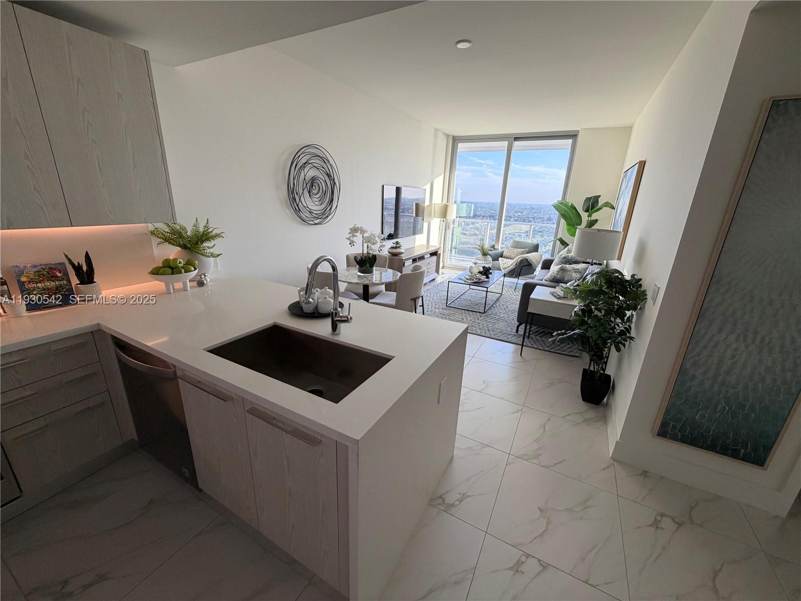 Seller's Special, Owner will Contribute with 3% of sales Price or delivery the unit furnished and decorated! Modern and spacious 2bed / 2bath condo for sale at the iconic Metropica in Sunrise! Located on the 21st floor with stunning panoramic views, this unit features an open-concept layout, floor-to-ceiling impact windows, European-style kitchen with quartz countertops and Whirlpool stainless steel appliances, and sleek porcelain tile flooring throughout. Enjoy resort-style amenities including a rooftop pool, fitness center, spa, business center, tennis court, 24-hour concierge, valet, and more. Washer/dryer in unit. Assigned parking included. Walk to shopping, dining, and entertainment at Sawgrass Mills. Available for immediate move-in! Easy to show. Lease with Option Available.