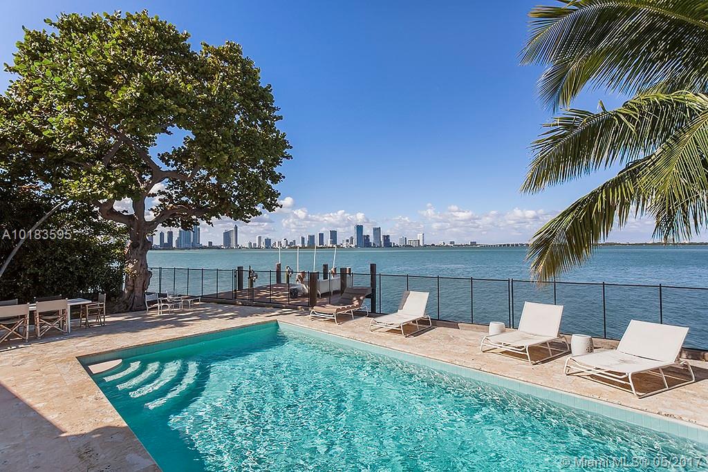 Enjoy stunning views of the bay, Miami skyline & breathtaking sunrises & sunsets in this contemporary waterfront property feat. 100ft on the water. This beautiful home boasts high-end finishes throughout, a large heated pool, private dock & coral stone deck, perfect for entertaining! Features include luxurious baths, European kitchen, impact windows, French doors, wiring for state-of-the-art smart system, high ceilings & white crystal floors. Also includes a separate guest house w/ a separate 1 car garage