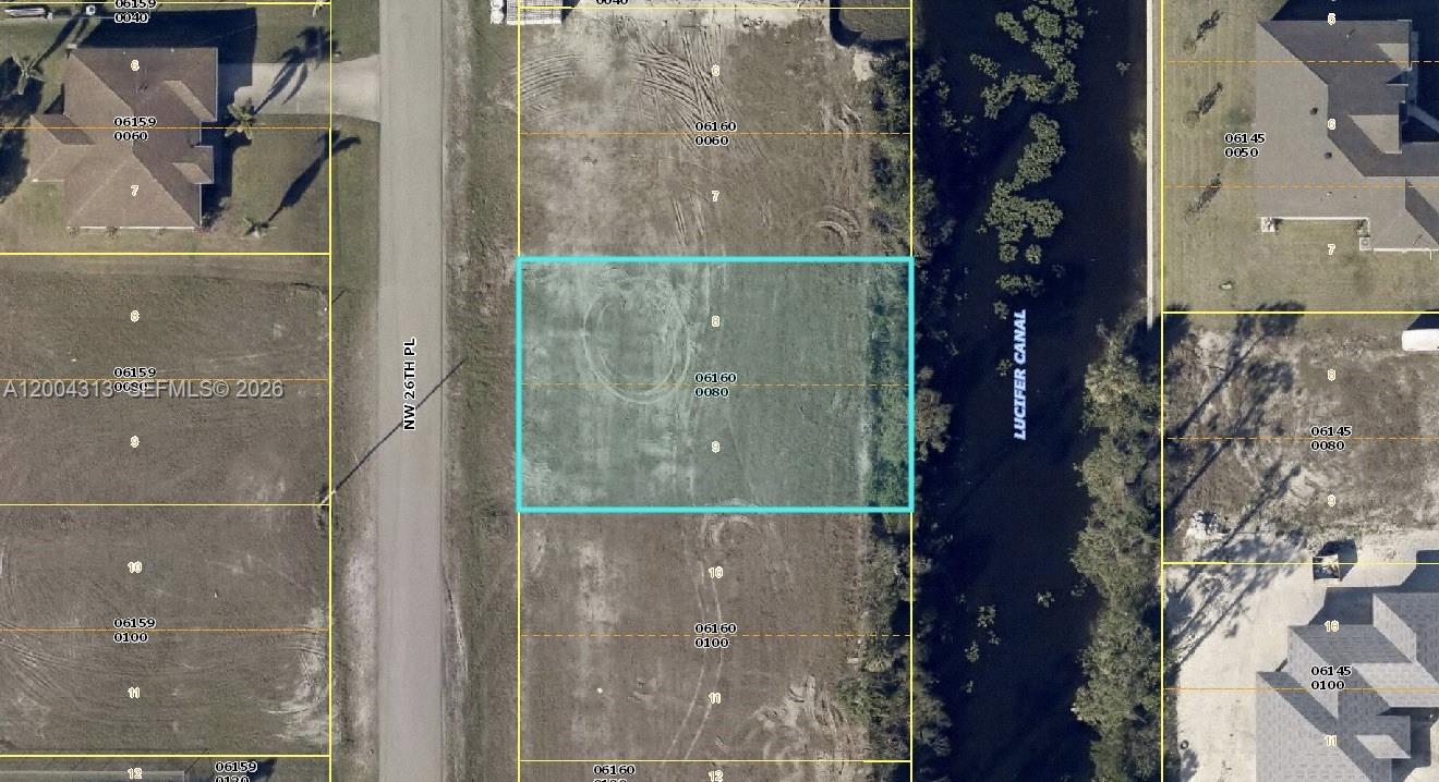 Amazing opportunity to own a lot in Cape Coral with views to the "Lucifer Canal". Ready to build.