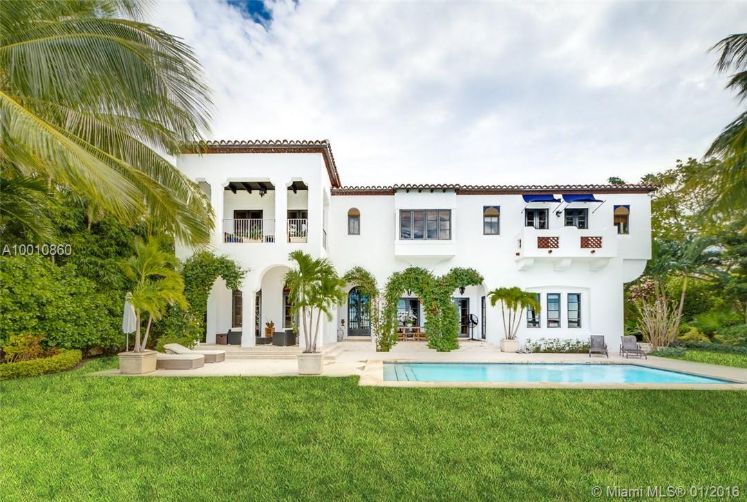 Moorish style estate built in 2004 w/ sweeping wide bay/skyline views. Custom wood & wrought iron door opens to interiors of stone & hardwood floors, stunning arched hallways complemented by natural light. Interiors: Spacious living room, formal dining room w/ custom wood ceilings & gourmet  kitchen w/ stainless steel appliances. Master suite w/ 2 walk in closets, guest house, balconies, French doors from evry room w/ access to multilevel courtyard & views 117’ of waterfront, pool & boat dock w/lift