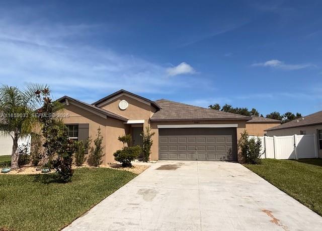 Enjoy this modern and beautiful home built in 2021, offering total privacy with no neighbors behind. Perfect for young families or retirees seeking comfort and tranquility. Spacious and functional, this 4-bedroom, 2-bathroom residence features a large garage and an open floor plan that seamlessly connects the living room to the kitchen, equipped with a center island and breakfast bar. The primary suite boasts a large walk-in closet with double hanging rods to maximize space. Laundry area includes washer and dryer. Relax outdoors with serene pond views and peaceful surroundings. No CDD fees and a low HOA fee covering basic cable and internet. Strategically located near major roads and shopping centers. Don't miss this remarkable property! Schedule a showing today.