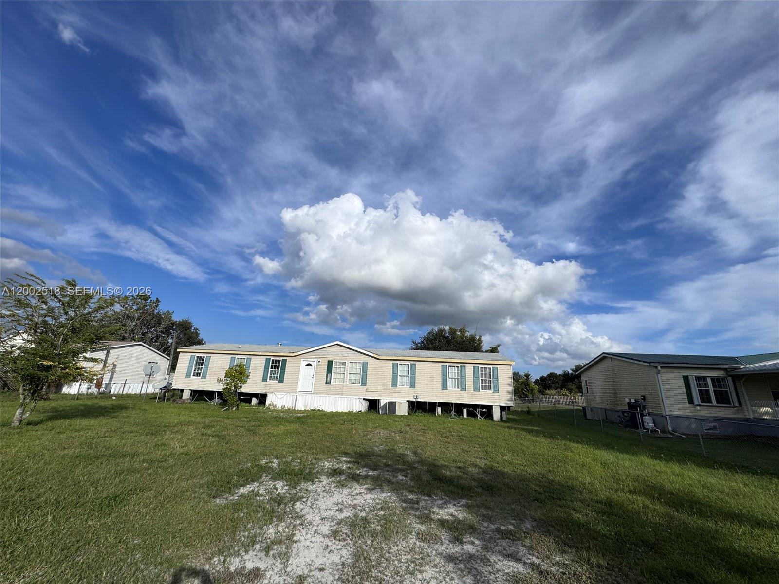**MOTIVATED SELLER** Spacious 2,188 sq ft mobile home situated on a generous ½-acre lot in Okeechobee. Recently updated with a new roof, this property offers great potential with just a little TLC. Plenty of room to spread out, both inside and out, perfect for those seeking space and value. BRING YOUR OFFERS!!