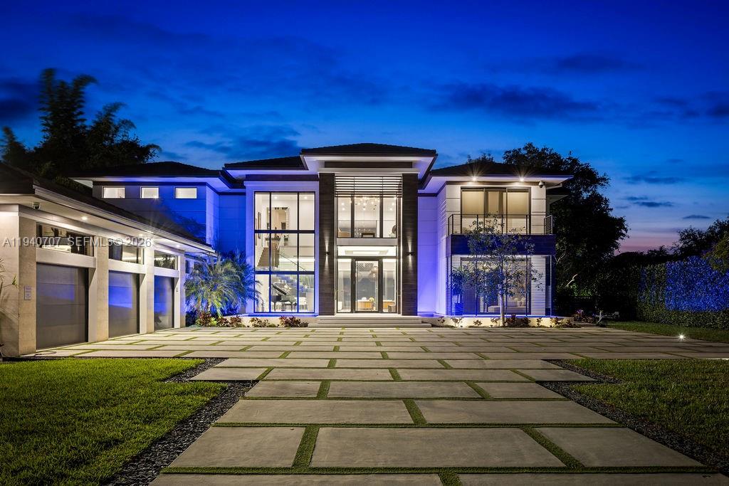 Exceptional Value Pricing. This luxury masterpiece estate, set on nearly one acre, features 8 Bedrooms, 7 1/2 baths/Separate Guest House- Gated Drive Through Lot- Large Spacious Elevator - 60KW Kohler Generator-Underground 1000-Gal Propane Tank-Designer Electrical Shades in all living areas-Theater / Media Room, Gutters, Garage includes professional cabinetry w/marble tops, Premium Flooring, Organizational Slate Wall and 2 Ton Mitsubishi Mini-Split Air conditioner, Custom Summer Kitchen with 56" Alfresco Grill, Cookers and Griddle, Icemaker, Refrigerator and Sink w/Kohler faucets.  Living area with Custom Bar, Outdoor Security Cameras throughout the exterior of the home.