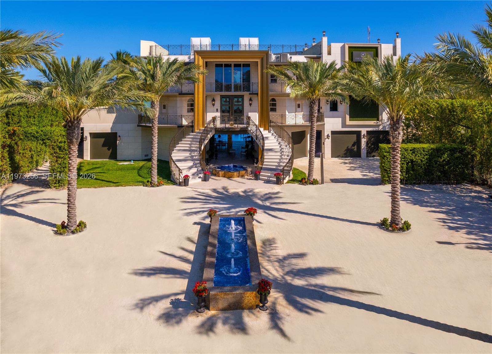 Experience unparalleled oceanfront living at Chateau On The Ocean, a turnkey private estate set within an exclusive enclave in Islamorada. Here elevated coastal living reflects the sophistication of what has been referred to as the Hamptons of Miami.  From the moment you arrive, a striking sense of privacy, scale, and intention is evident, with architecture and surroundings that feel truly unforgettable. Completely reimagined and newly constructed in 2023, this residence showcases exceptional modern design, engineering, and craftsmanship. Set on just under 2 acres of pristine coastline, the property offers 19,784 SF of total living and entertaining space, including 10,182SF under air. Inside, soaring ceilings and walls of glass create a seamless indoor-outdoor connection, filling the interiors w/ natural light and highlighting refined, couture-level finishes. Amenities include a fitness center, indoor basketball and pickleball court, putting green, a Baccarat-inspired grand ballroom, and a custom Glamour Suite. Outdoors, a mosaic pool and spa overlook the Atlantic Ocean, complemented by alfresco dining, a firepit lounge, and multiple terraces w/sweeping coastal views. A 300" outdoor LED theater and rooftop terrace elevate the experience. A 100ft private dock provides direct ocean access.  Approved plans include 6 additional suites, including 2 oceanfront residences, allowing expansion into a multi-structure compound. A rare legacy estate defined by privacy, scale and presence