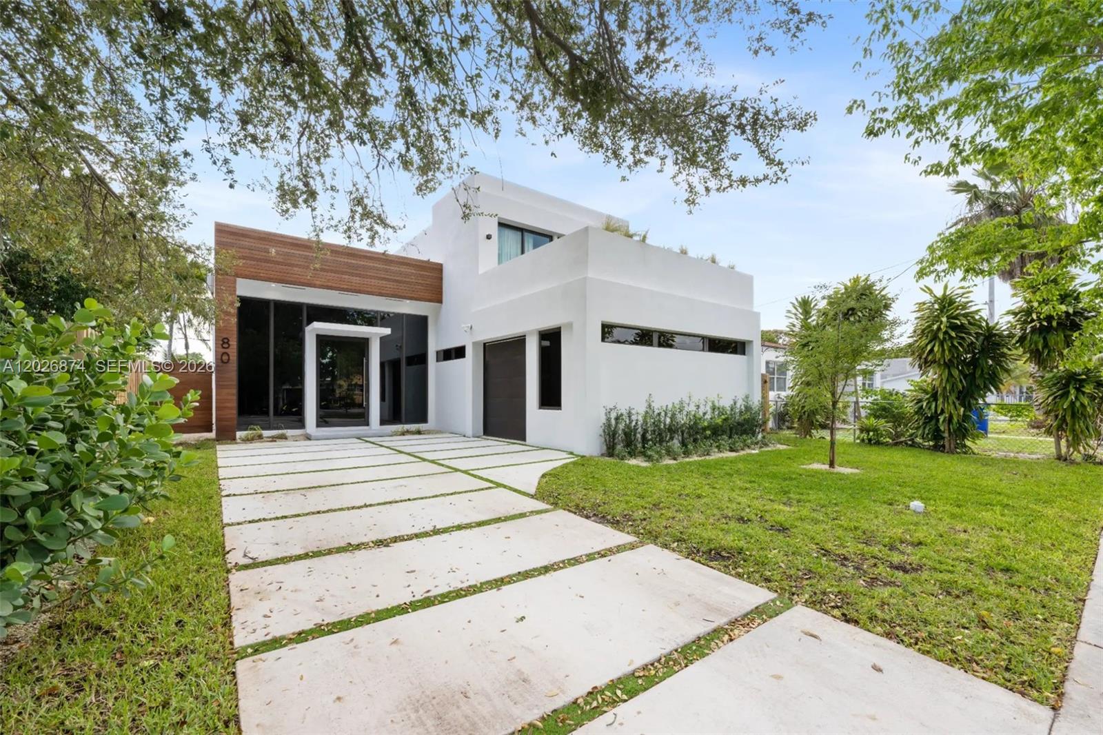 Welcome to this stunning Buena Vista residence, set on a 7,200 SF lot. Offering 3,385 total SF of refined living, the home features soaring 13' foot ceilings, elevated finishes, a sleek black accent chef's kitchen, and an additional 2-bed/1-bath converted garage.
Floor to ceiling windows flood the open concept layout with natural light, while the expansive backyard is made for effortless enjoyment, complete with a pool, patio, and dedicated BBQ area.
Perfectly positioned just seconds from Miami's best shopping and dining in the Design District, and only 10 minutes to Miami Beach.
Schedule your private showing today.