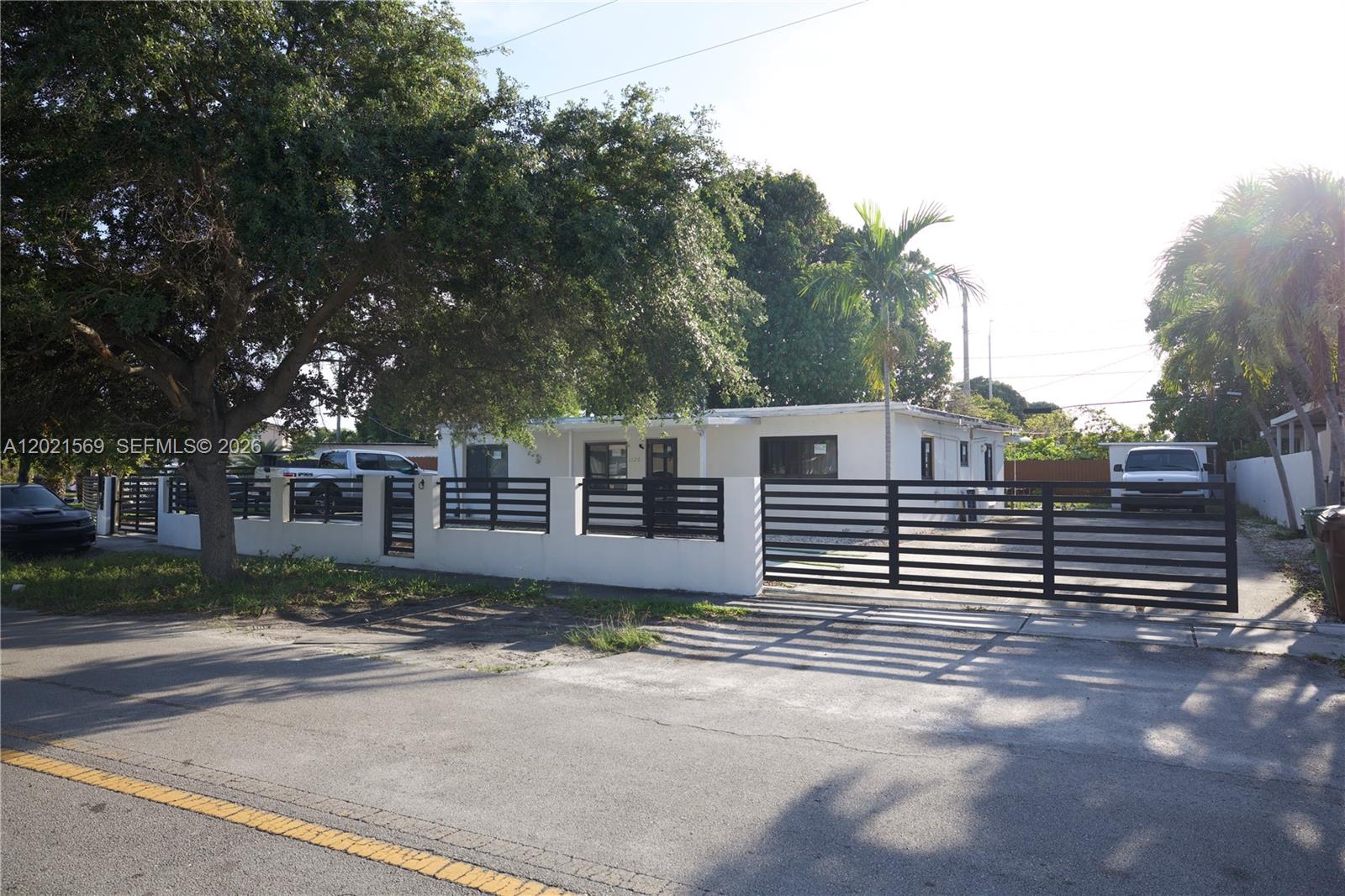 Potential that goes beyond what you see today. Built with concrete block construction and a concrete slab roof, with the possibility to build a second story. Sale includes fully approved plans and permits, ready to begin construction at closing. Approved additions include a primary suite expansion with walk-in closet, private bathroom, separate entrance, and independent A/C. The last bedroom is also approved for a private bathroom, separate entrance, and independent A/C, offering great flexibility and income potential. Impact windows and matching ceramic floors for the additions are also included. Conveniently located at the entrance of Hialeah.