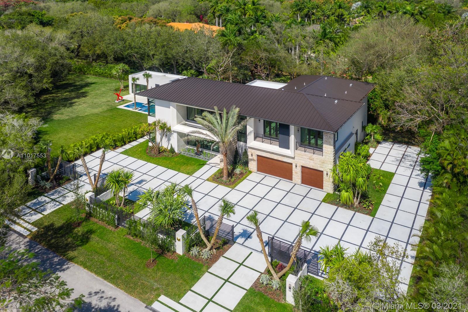 Furnished, Rich Decorated, and turn Key, Situated on a magnificent Cool de Sac Lot, The Mansion 6775 at Pinecrest is a Luxurious home with contemporary Bali Architecture, Custom Luxury Mansion Build by Devtov. Located at the north of the city, next to the most prestigious schools. 2 Story home with an accessory building, 6 bedrooms, and 6.5 bathrooms in the Main house, additionally 2 bedrooms and two bathrooms in the Guest House. Long Lap Pool with Jacuzzi, Expansive Covered Summer Kitchen, Lush Landscape, and Tanning Pool Deck. Your family and loved ones will enjoy the spacious backyard, perfect for family gatherings!