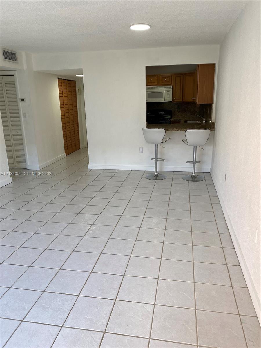 Excellent opportunity in Hialeah! Spacious 1-bedroom, 1 full bathroom, and 1 half bathroom. Offers great natural light, two balconies, tile floors throughout, and an in-unit washer and dryer. Ideal for investment. Tenant in place until July 2027. Tenant pays $1,950 a month. Centrally located behind Olive Garden and 49 Street, near shopping, dining, schools, and major highways. Great value in a high-demand area!